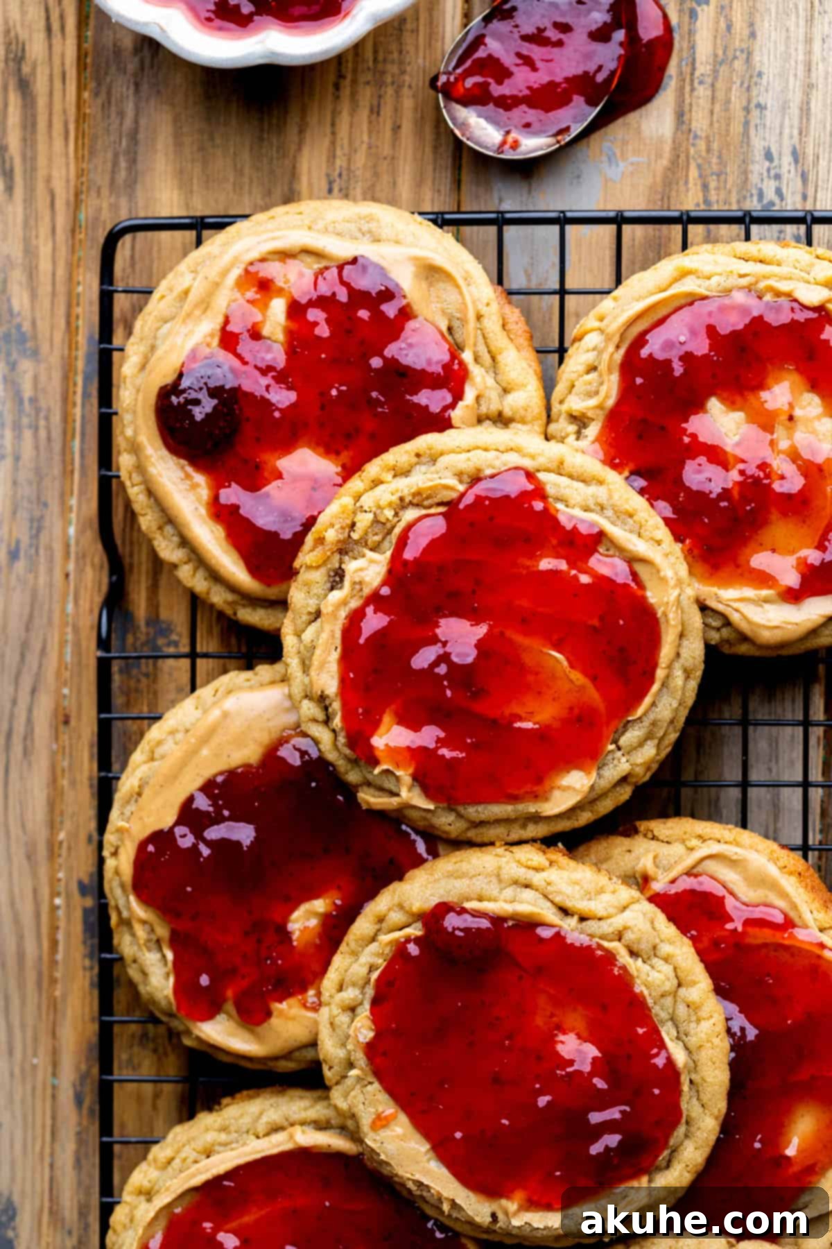 PB&J Cookies 11 Peanut butter and jelly cookies on a wire rack.