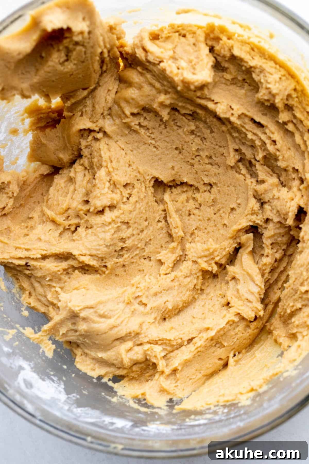 PB&J Cookies 5 Peanut butter cookie dough in a glass bowl.