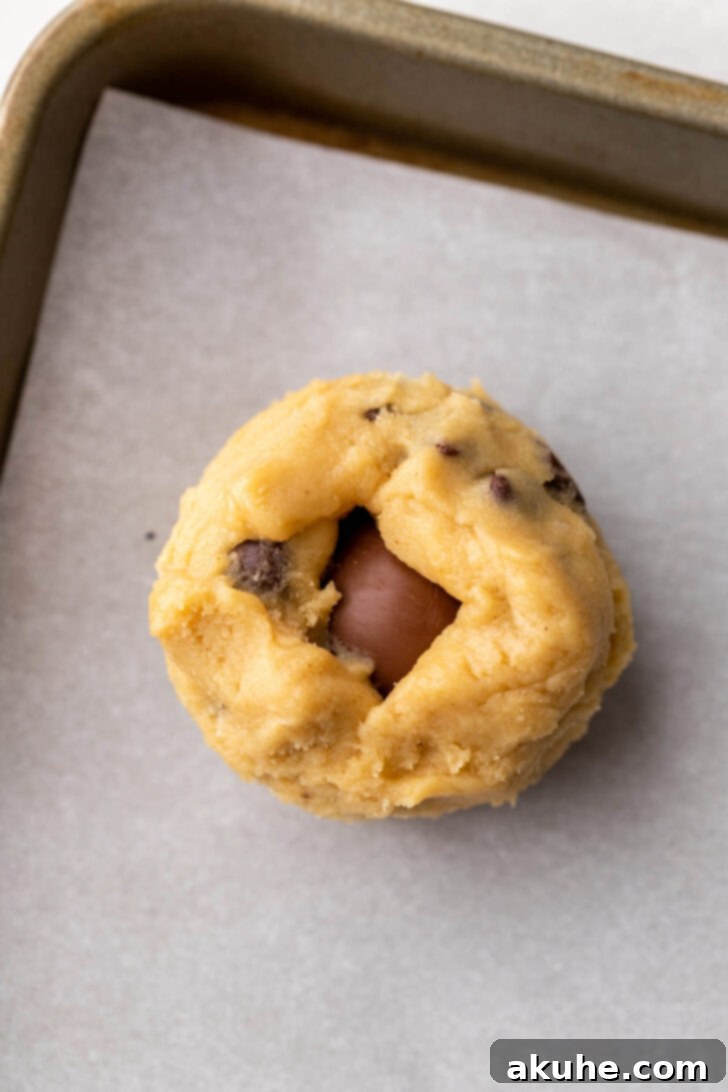 Cookie dough ball on a cookie sheet.