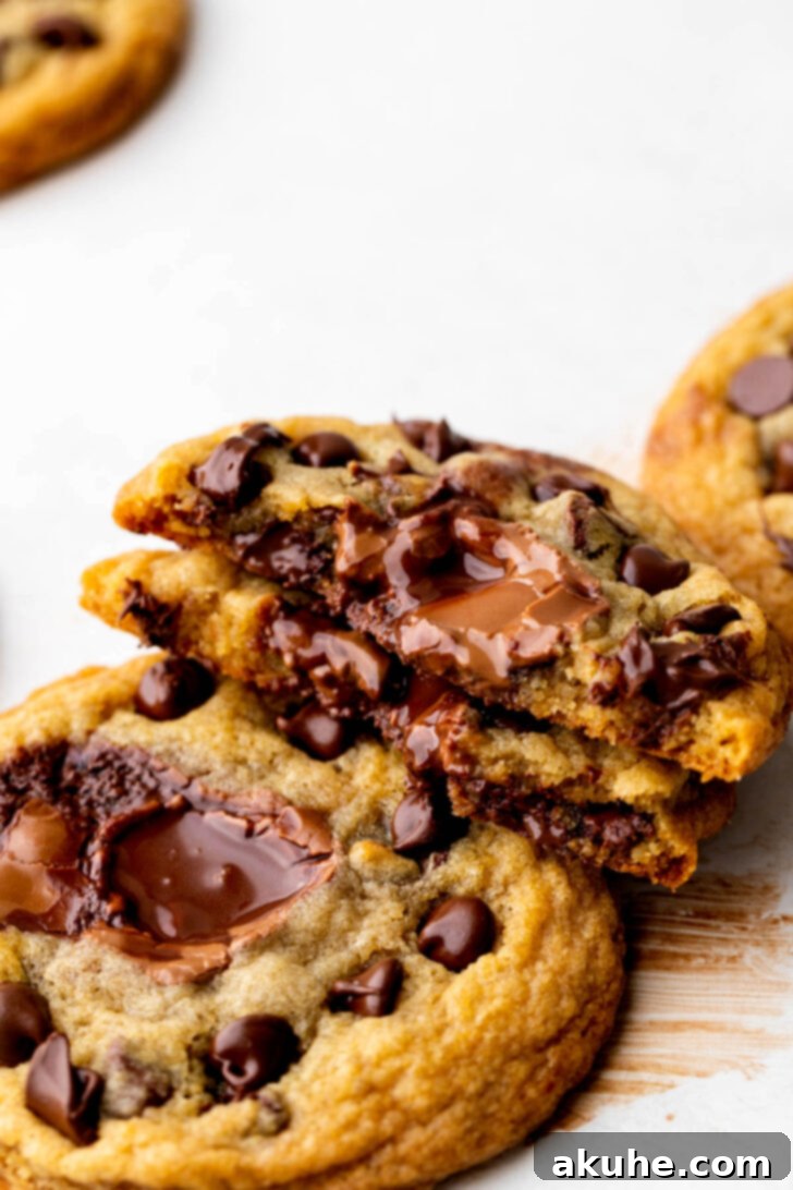 One lindt stuffed cookie split in half to show the inside.