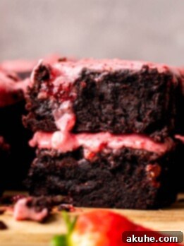 Decadent Strawberry Brownies 13 Stack of two strawberry brownies.