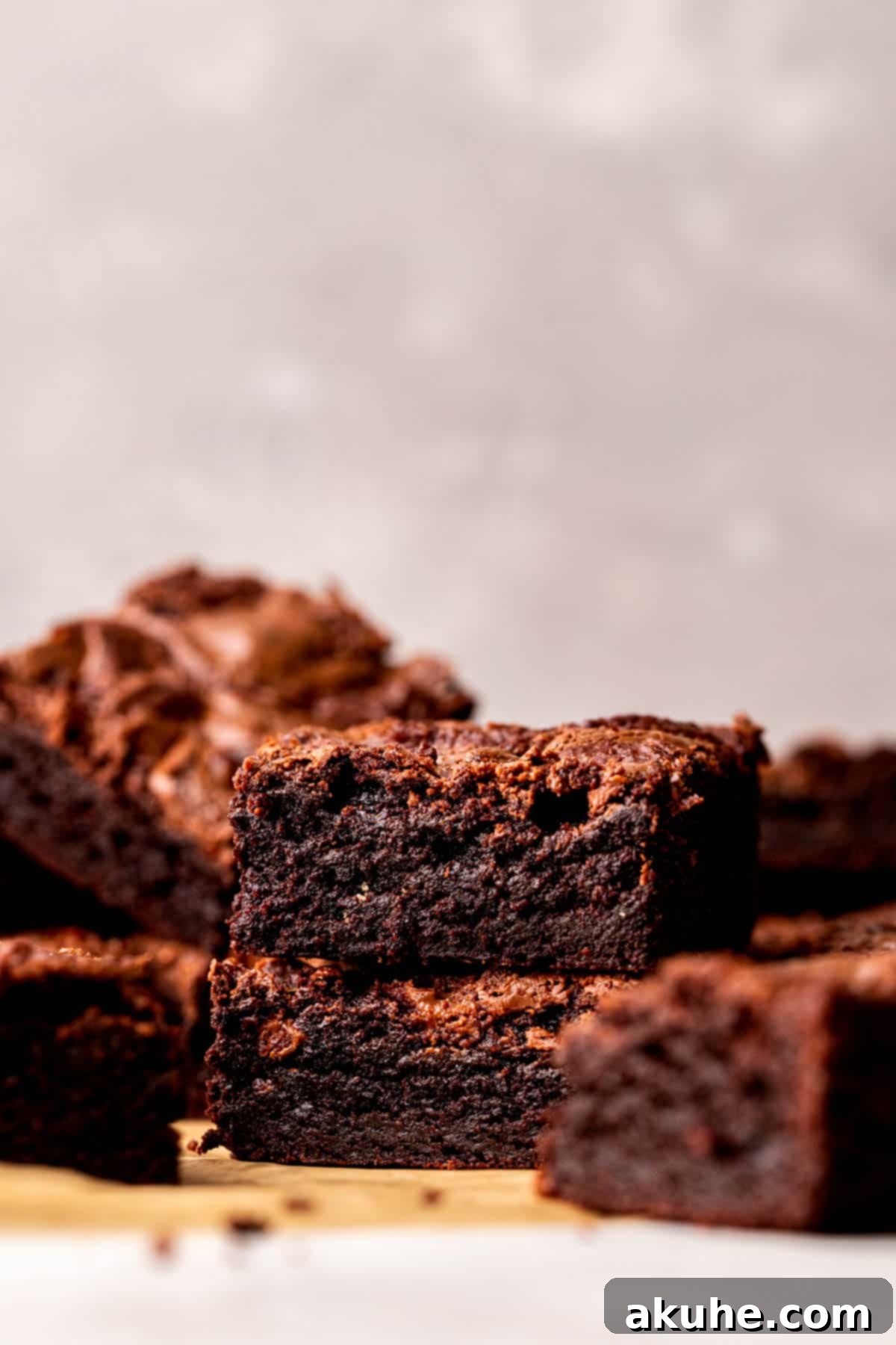 Decadent Nutella Brownies 3 Stack of two perfectly baked Nutella brownies, highlighting their dense texture.