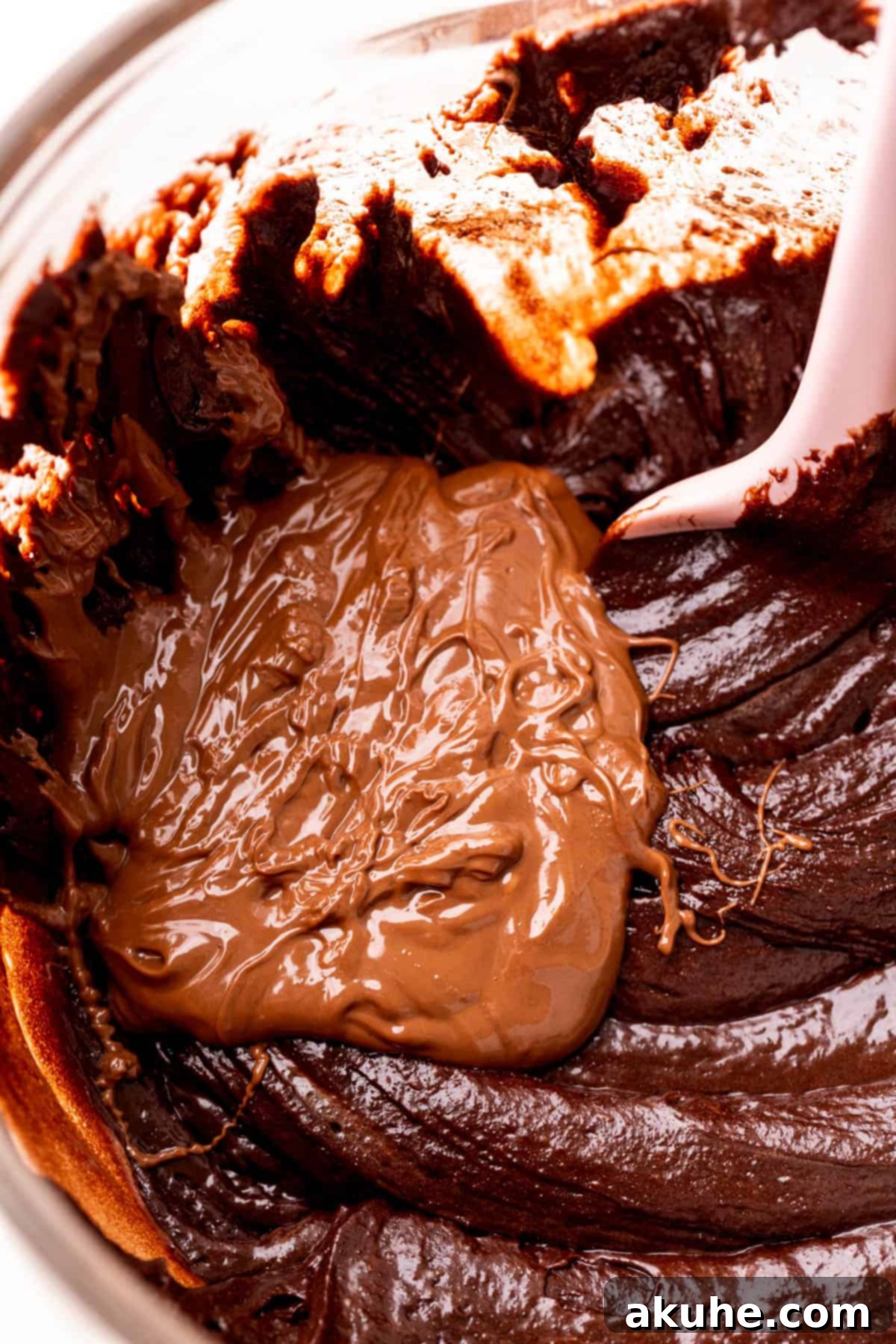 Decadent Nutella Brownies 5 Melted Nutella drizzled on top of brownie batter before swirling.