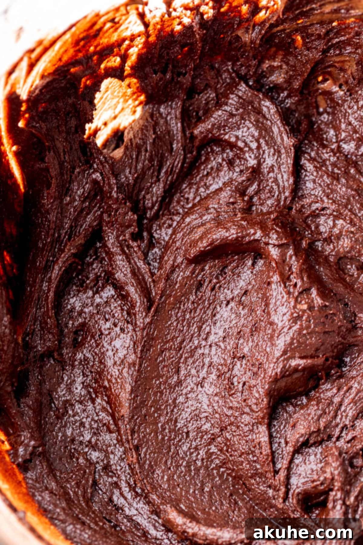 Decadent Nutella Brownies 6 Smooth brownie batter in a glass bowl, ready for Nutella.