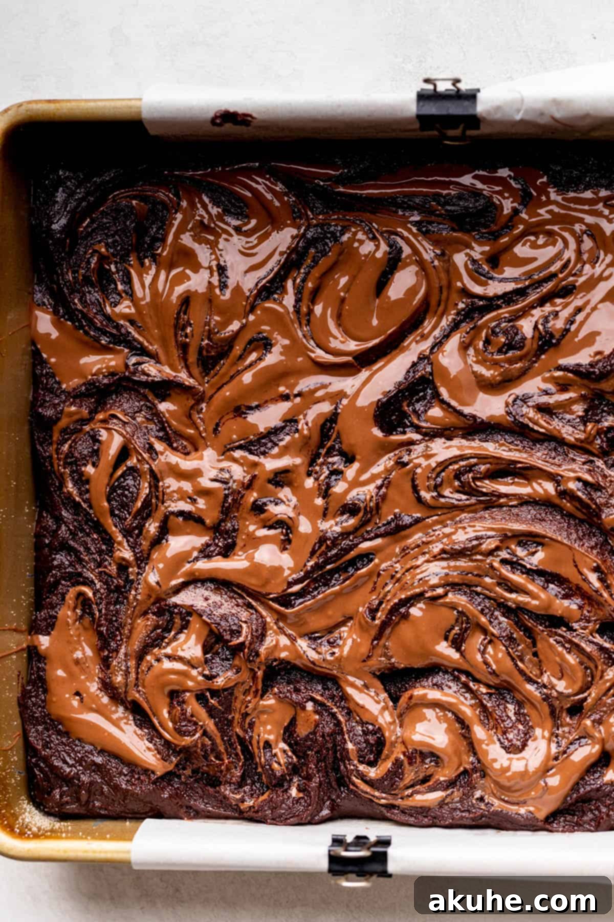 Decadent Nutella Brownies 8 Swirled Nutella on top of brownie batter, creating a beautiful pattern.