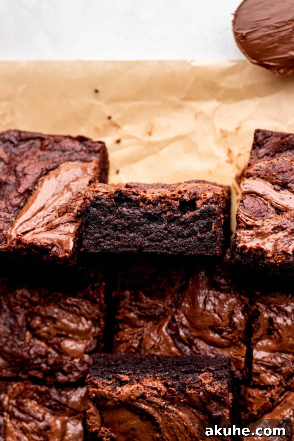 Decadent Nutella Brownies 9 One Nutella brownie on its side, showcasing its thick, fudgy profile.