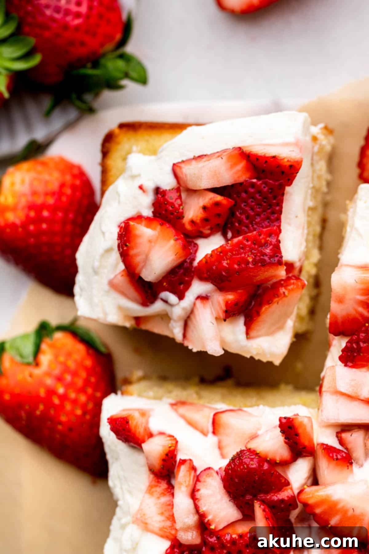 A top-down view of a single slice of strawberry shortcake, ready to be enjoyed.