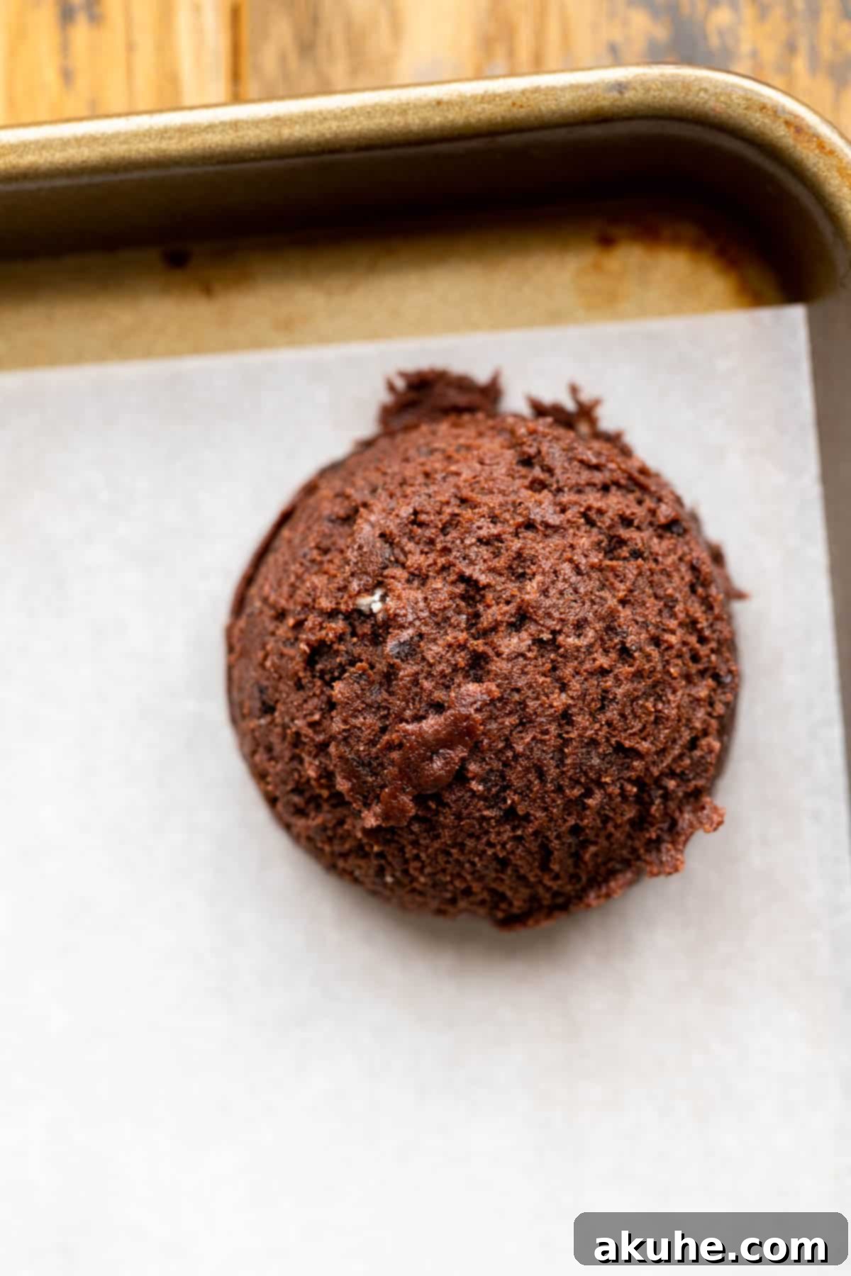 Cookie dough balls on a cookie sheet, ready for the oven.