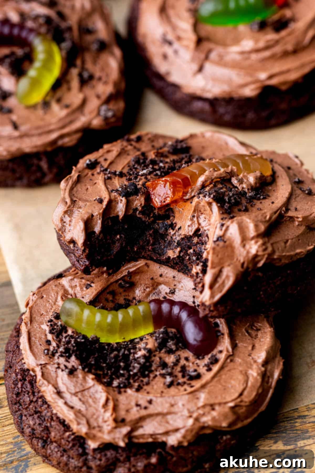 A dirt cake cookie with a bite missing, showing its deliciousness.