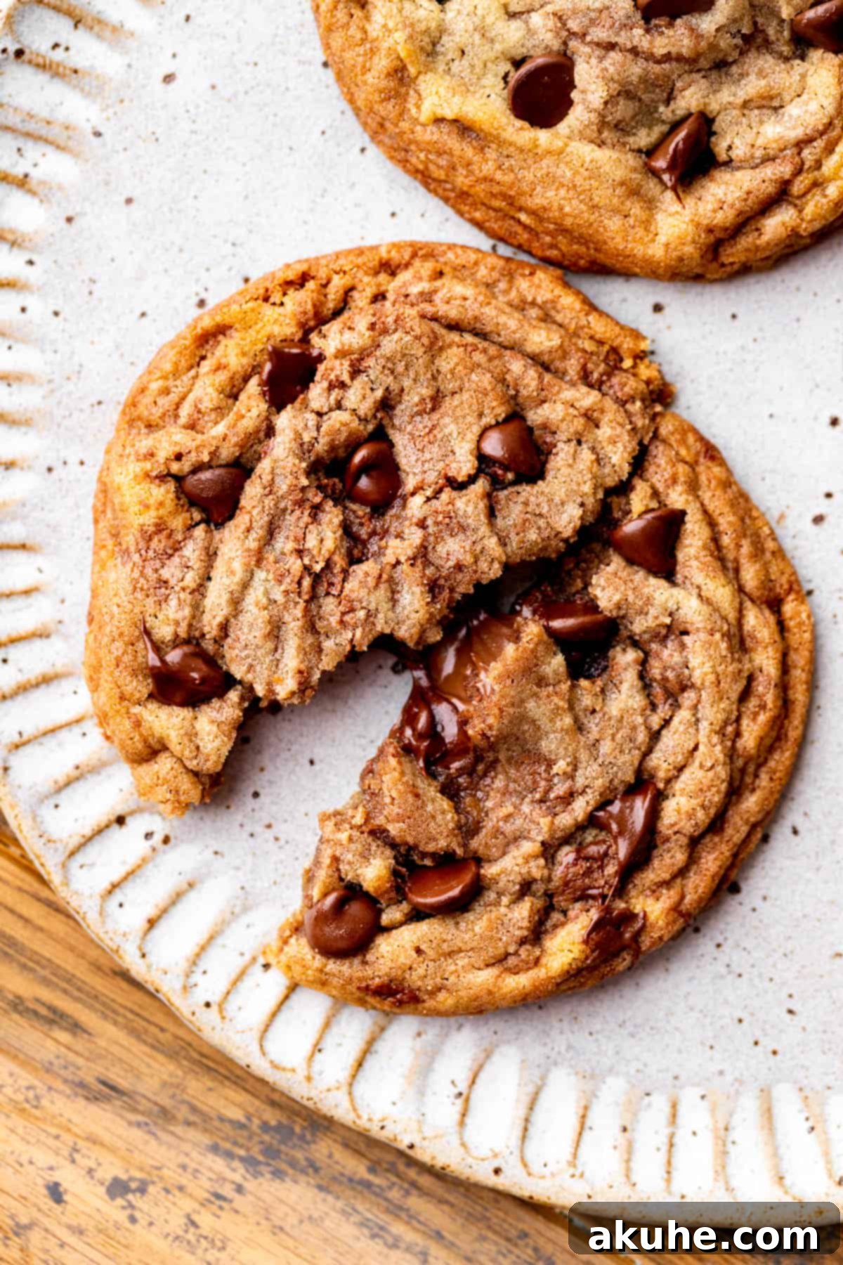 Swirled Nutella Delights 2 One Nutella cookie split in half, revealing a gooey Nutella center.