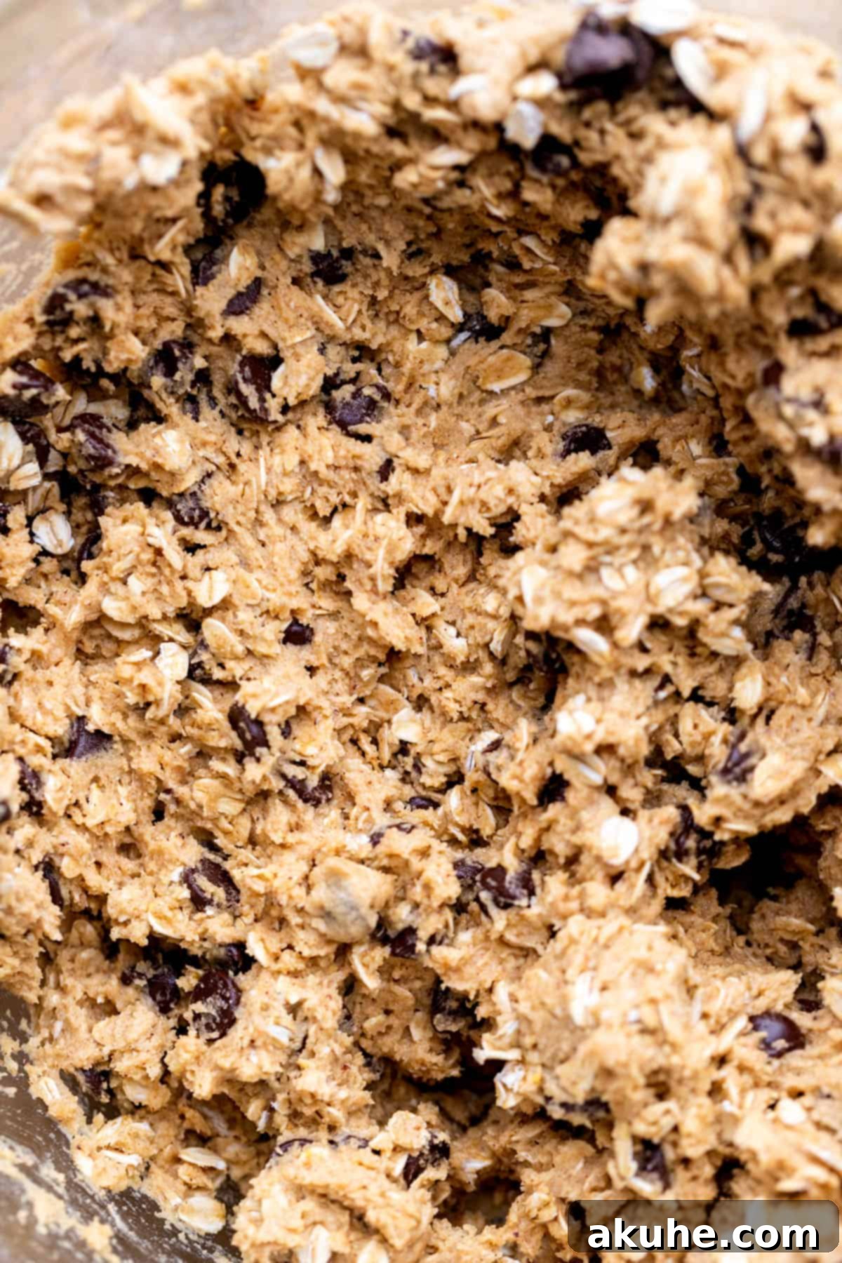 Bowl of freshly prepared cookie dough, ready for baking.