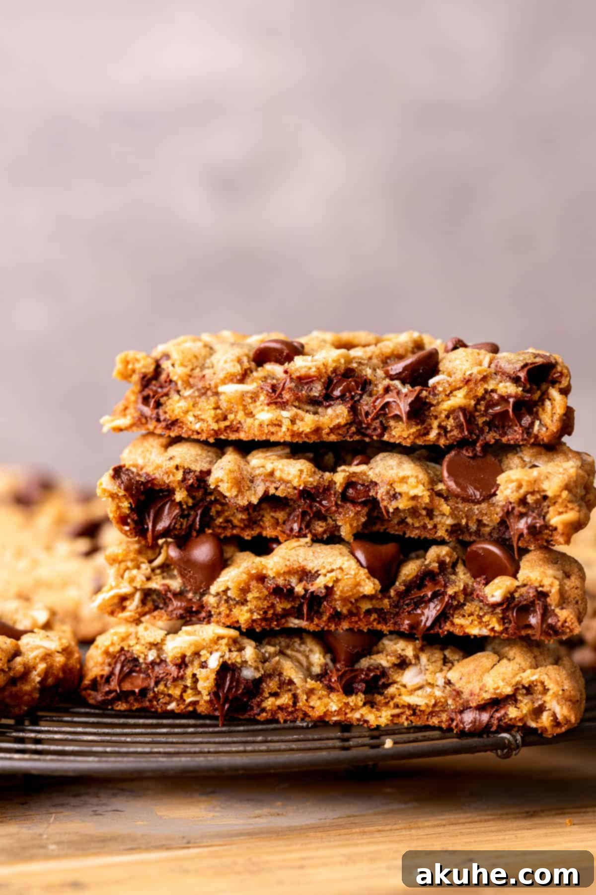 Close-up view of a perfectly baked oatmeal chocolate chip cookie, showcasing its texture and melted chocolate.