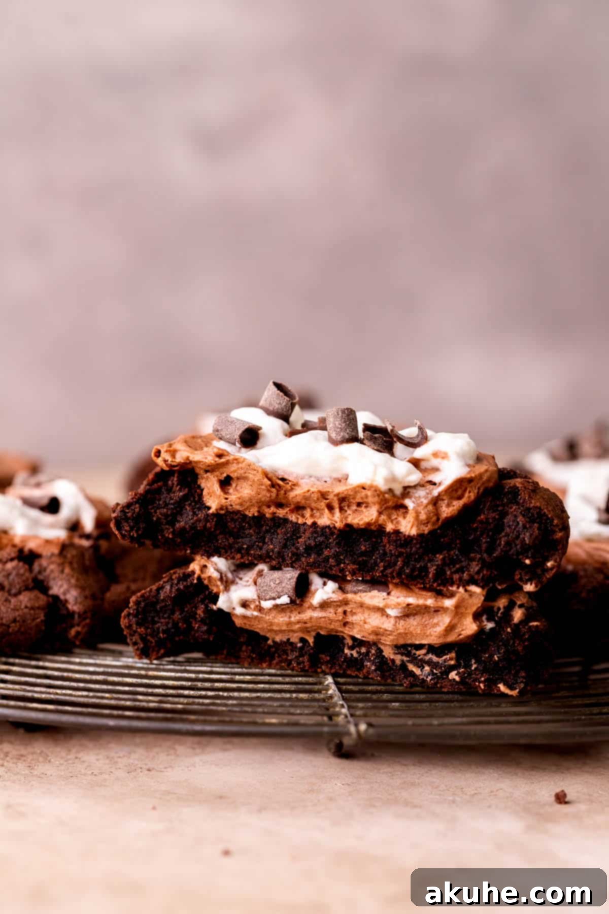 A French Silk Pie Cookie split in half, revealing the layers of chocolate cookie, mousse, and whipped cream.