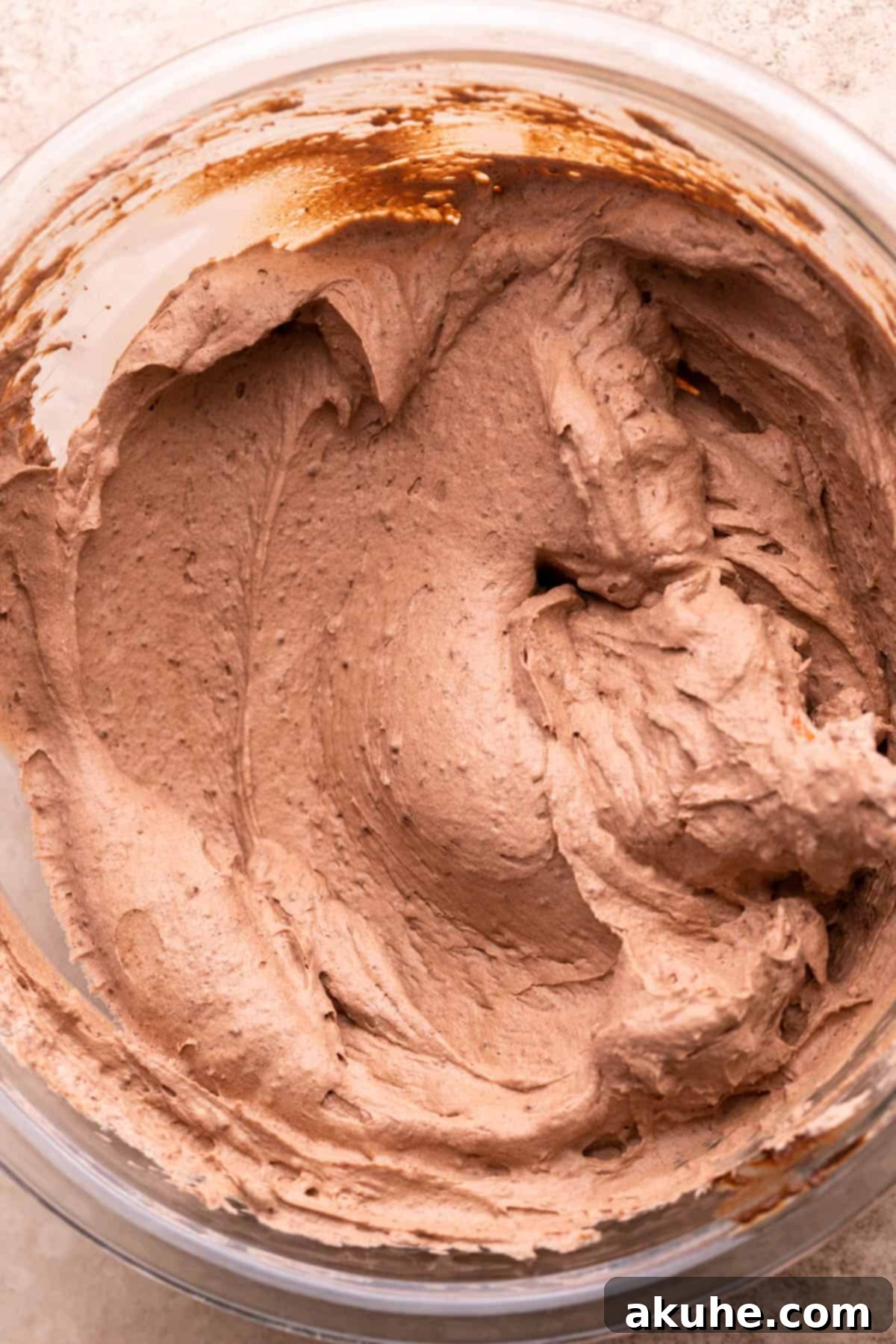 Smooth, rich chocolate pie filling (mousse) in a glass bowl.