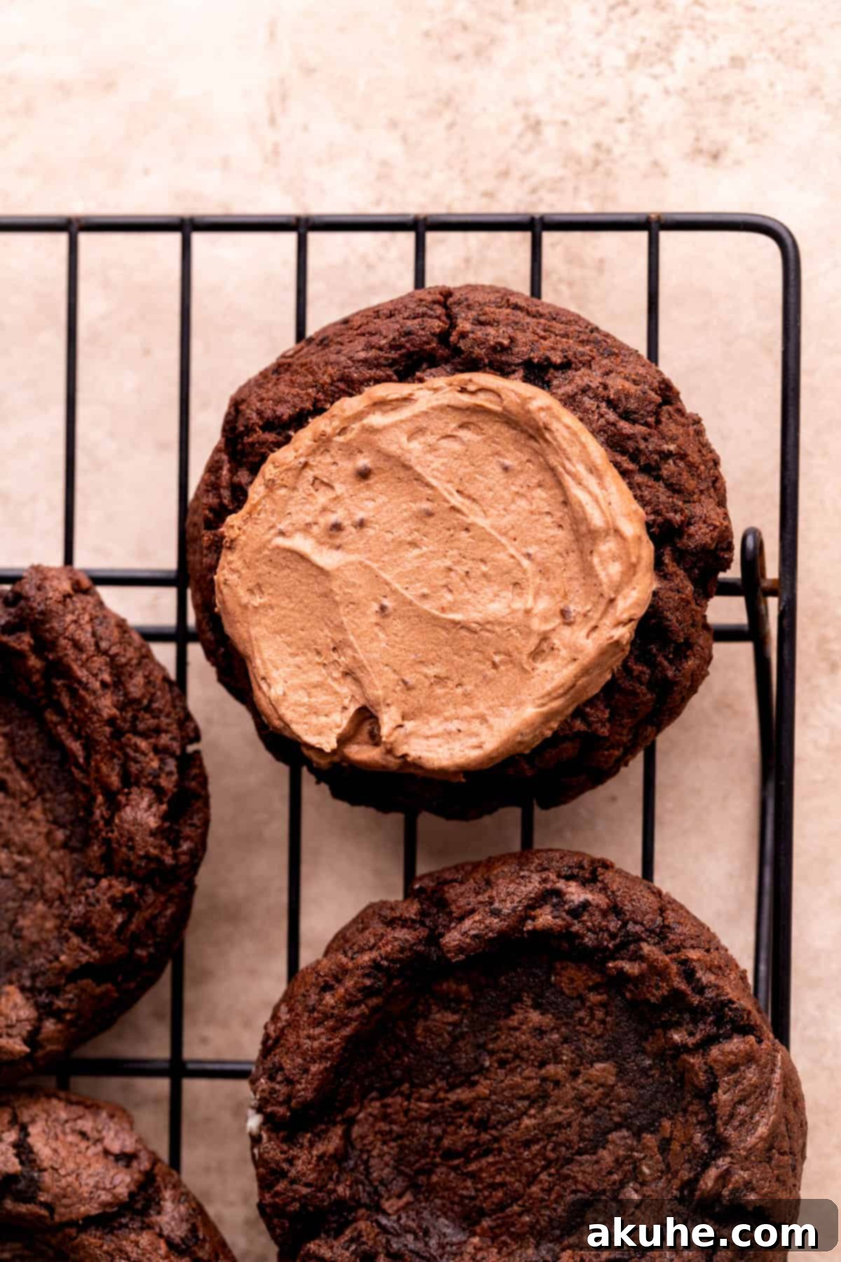 Chocolate pie filling smoothly spread in the center of an Oreo cookie.