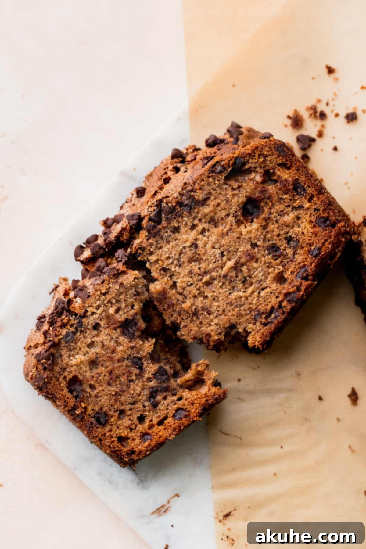Cinnamon Swirl Chocolate Chip Banana Bread 2 A perfectly sliced piece of Cinnamon Chocolate Chip Banana Bread, revealing its moist interior and chocolate chips.