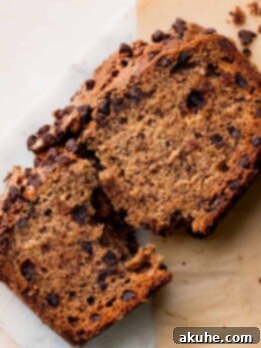 Cinnamon Swirl Chocolate Chip Banana Bread 11 One slice of cinnamon chocolate chip banana bread split in half.