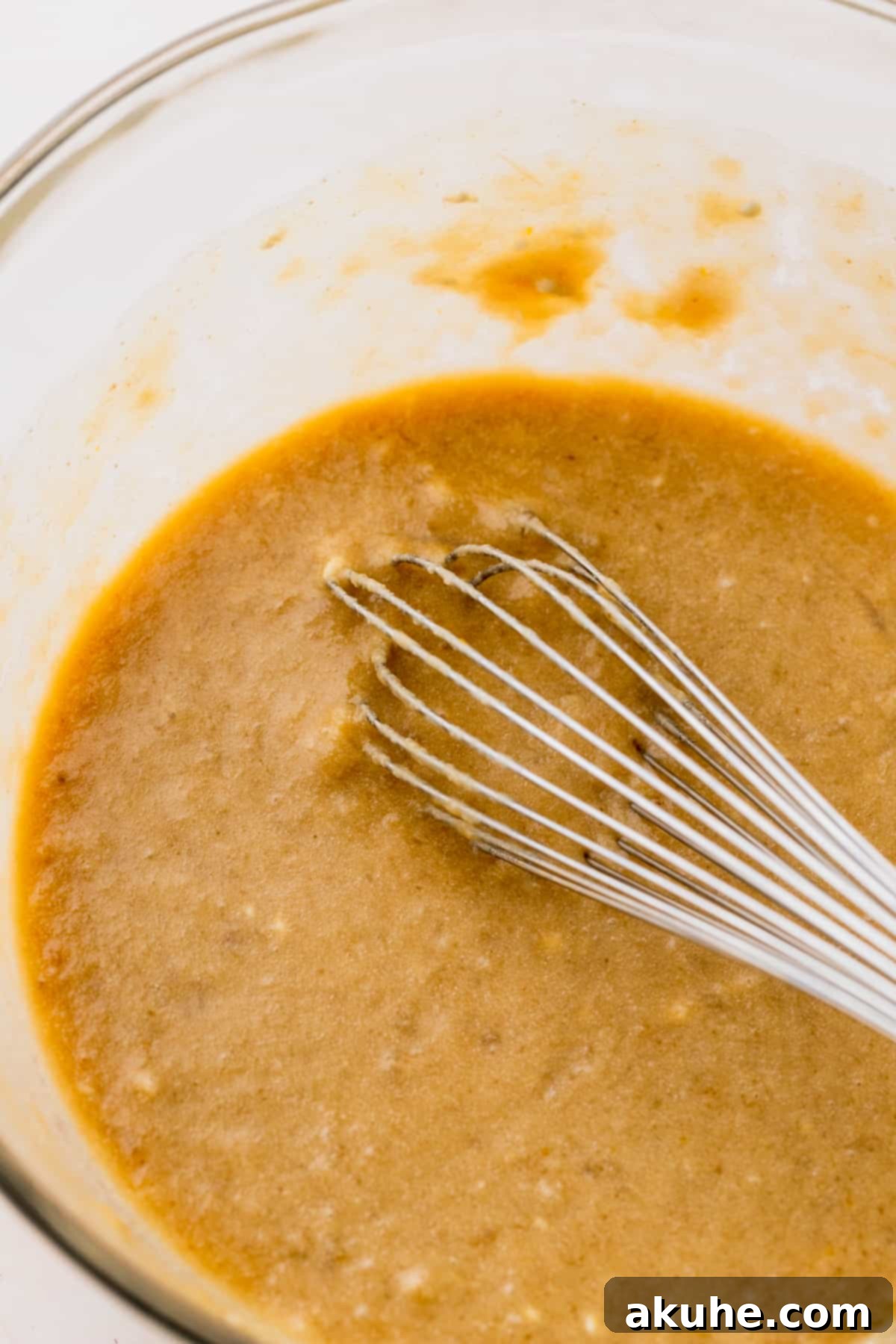 Cinnamon Swirl Chocolate Chip Banana Bread 4 Wet ingredients beautifully combined in a glass mixing bowl.