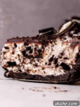 One slice of no bake oreo cheesecake on a pie cutter.