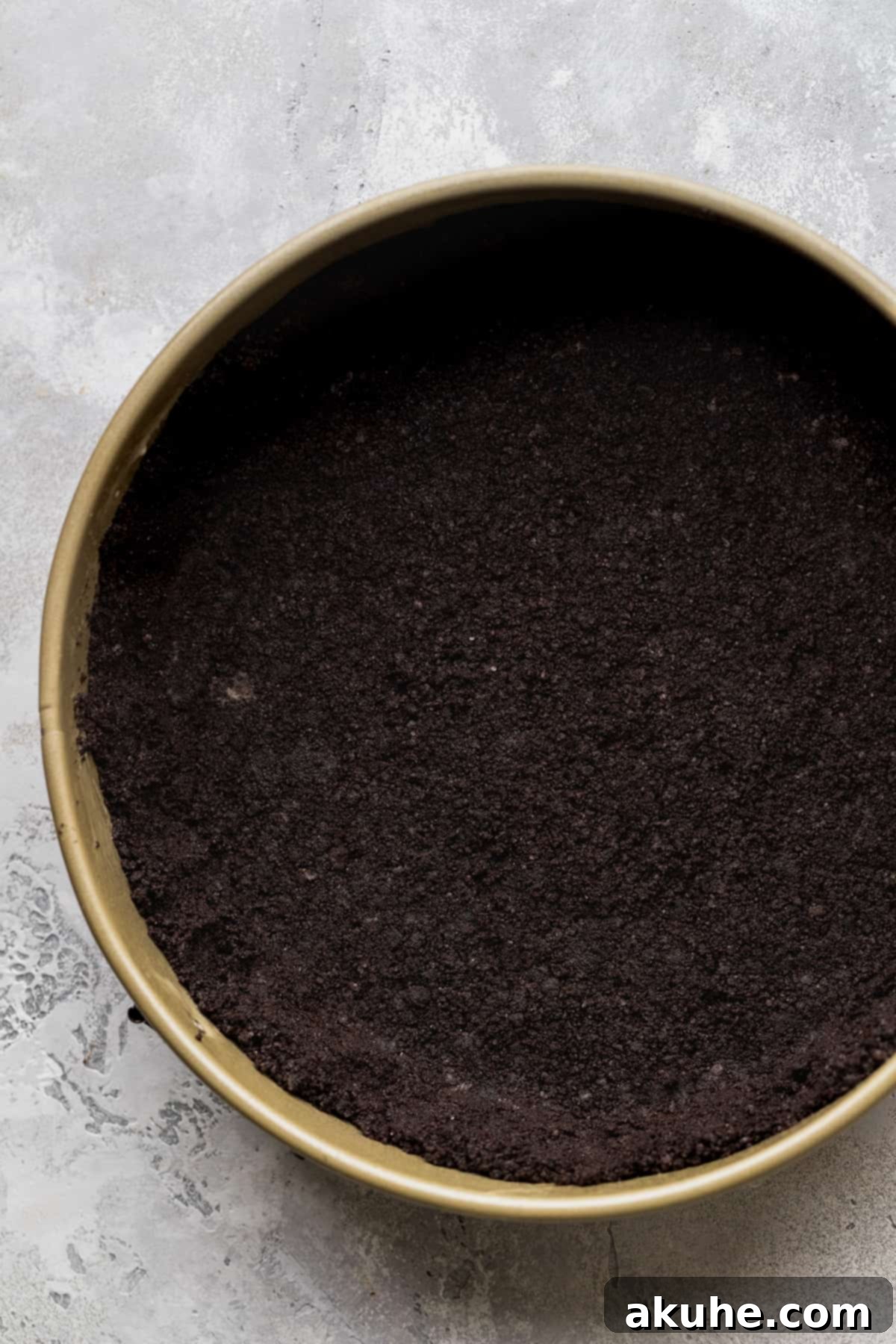 Oreo crust in a springform pan.