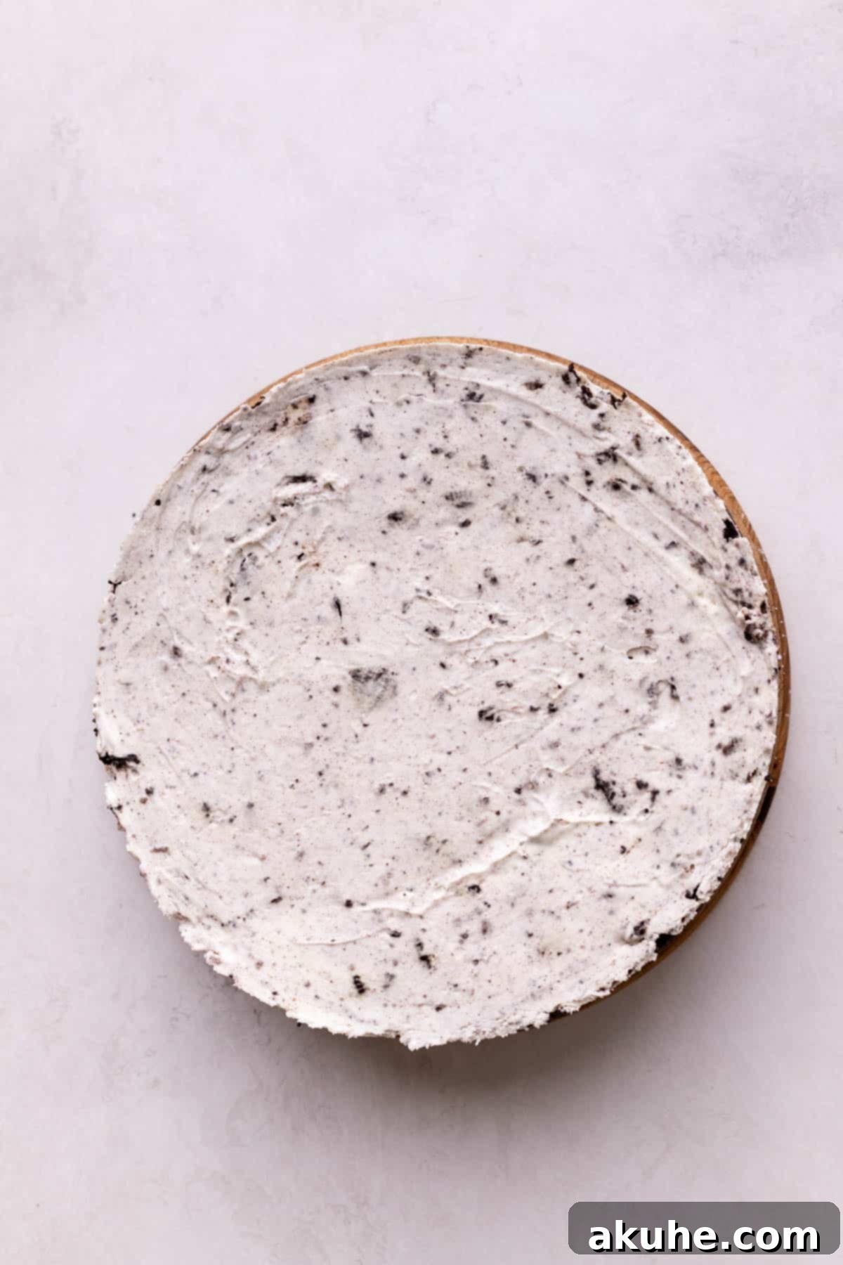 Chilled cheesecake on a board.