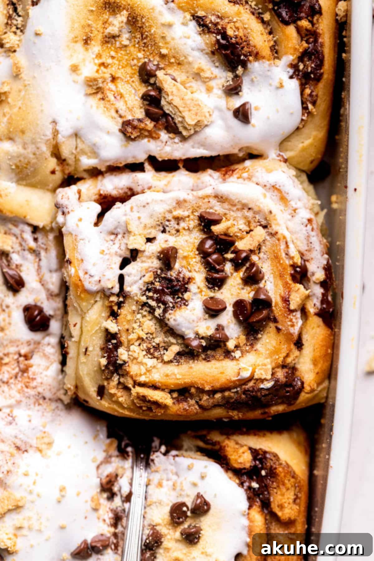 Gooey S'mores Cinnamon Buns 2 Top view of S'mores Cinnamon Rolls, showcasing the toasted marshmallow and melty chocolate.