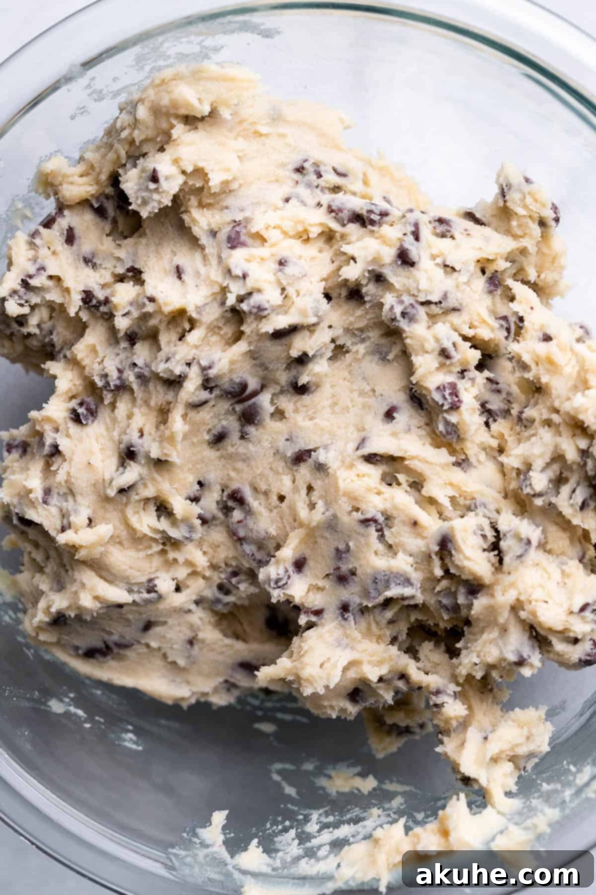 Cookie Dough Swirled Cinnamon Buns 6 Edible cookie dough mixture in a glass bowl, studded with mini chocolate chips.