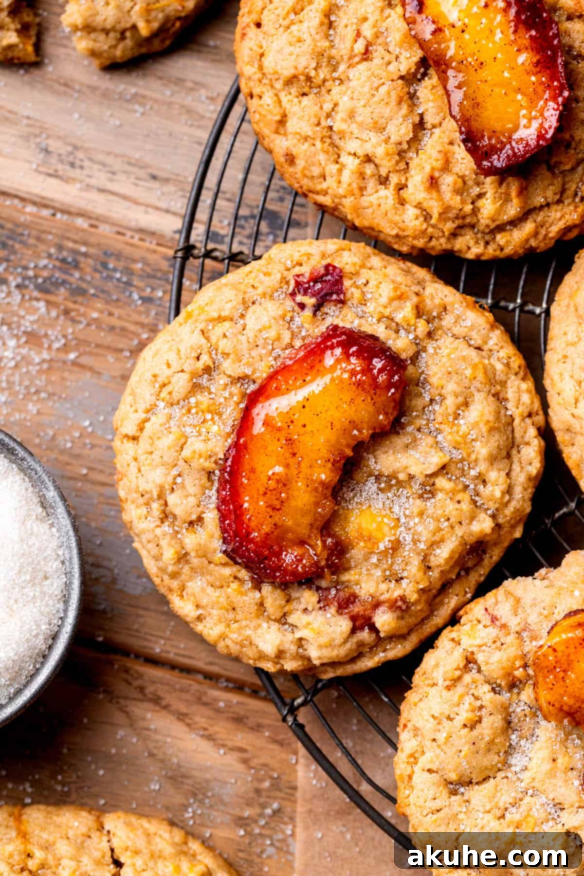 Sun-Kissed Peach Treats 2 Top view of peach cookies arranged beautifully on a plate, showcasing their golden-brown edges and soft peach toppings.