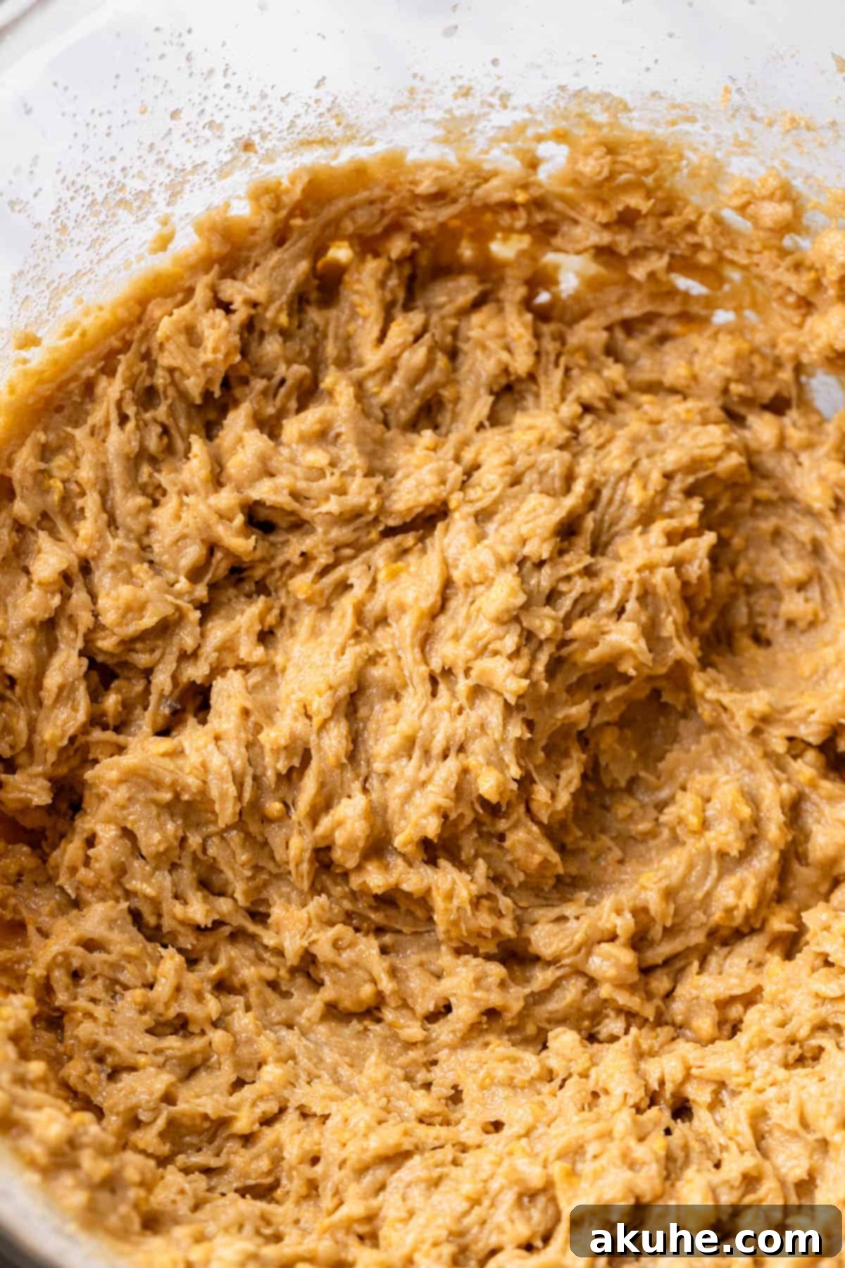 Sun-Kissed Peach Treats 6 A mixing bowl filled with the creamy, blended wet ingredients for the peach cookie dough.