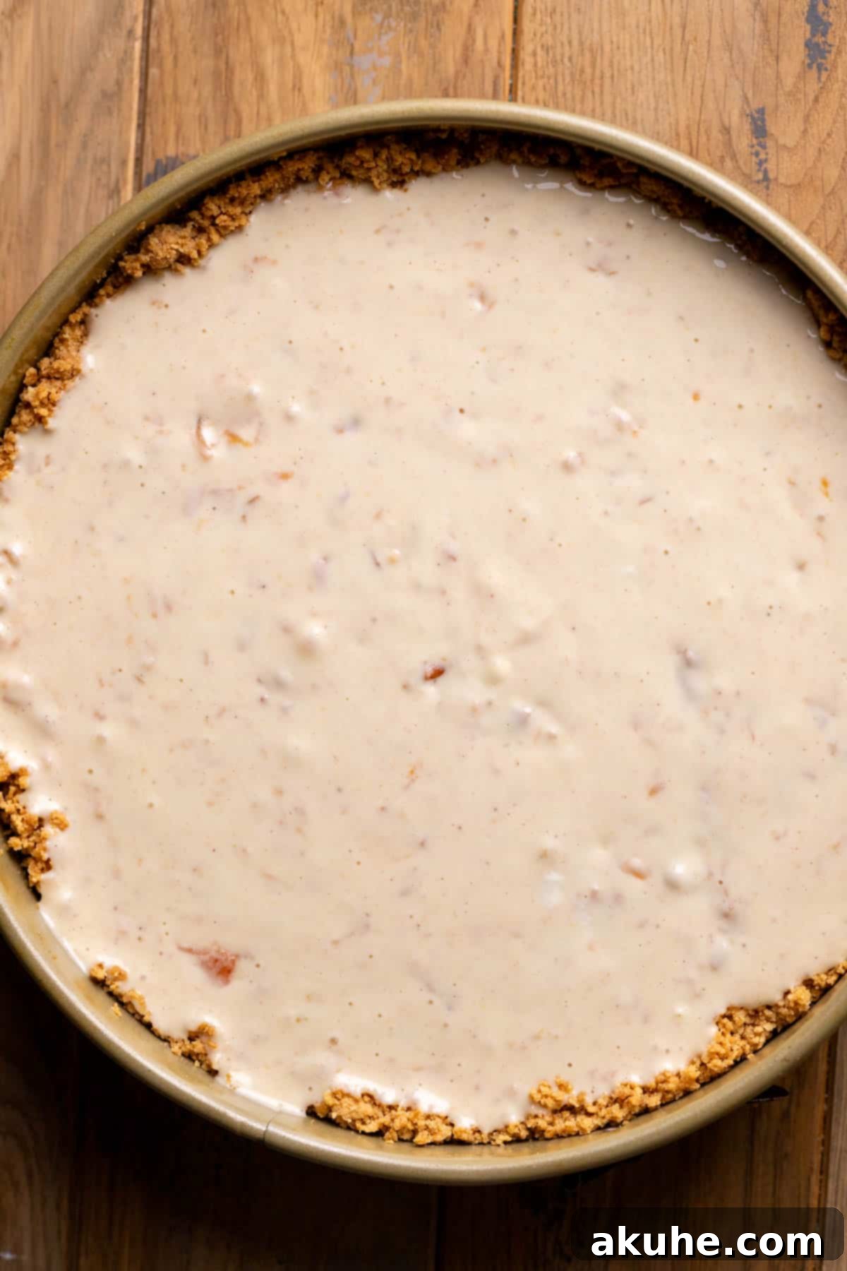 Luscious Peach Cheesecake 8 Smooth, unbaked cheesecake batter perfectly poured into a springform pan.