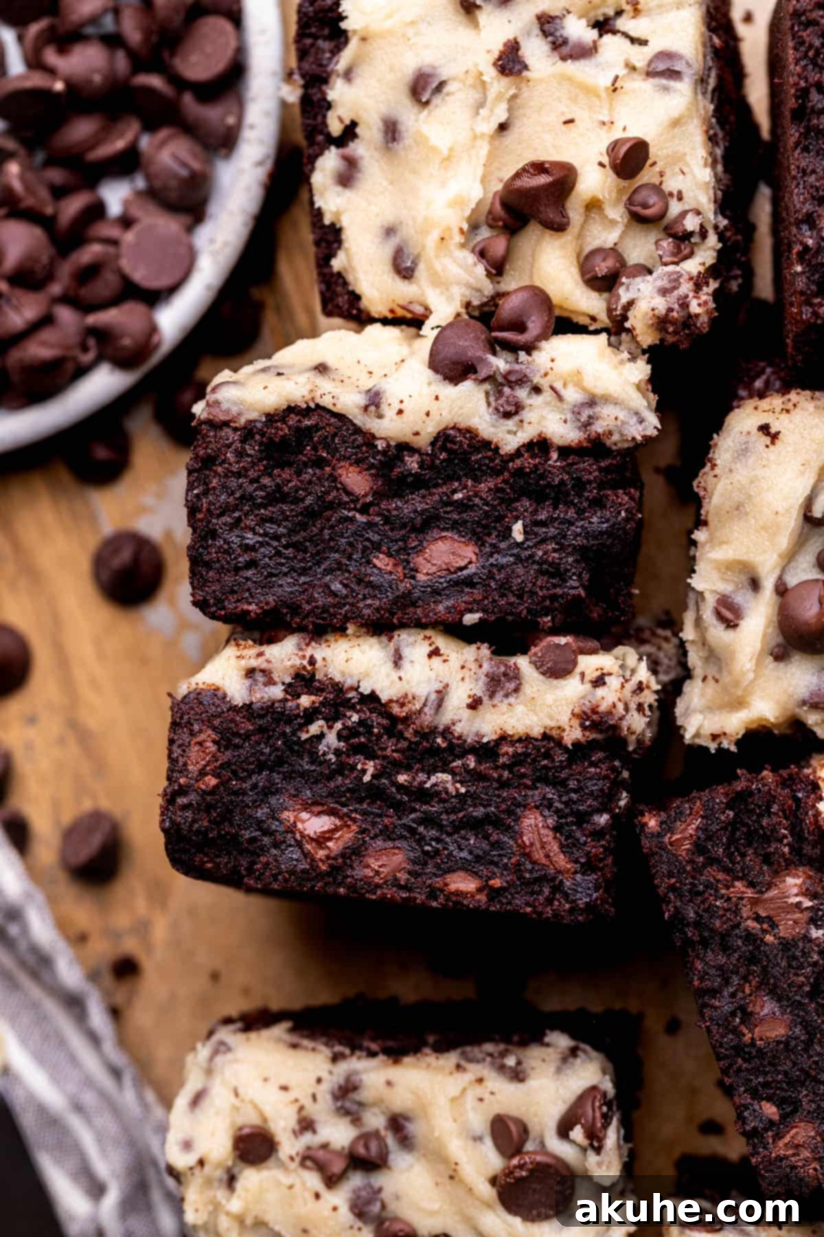 Decadent Cookie Dough Brownies 2 Side view of perfectly layered cookie dough brownies, showcasing the rich brownie base and thick edible cookie dough topping.