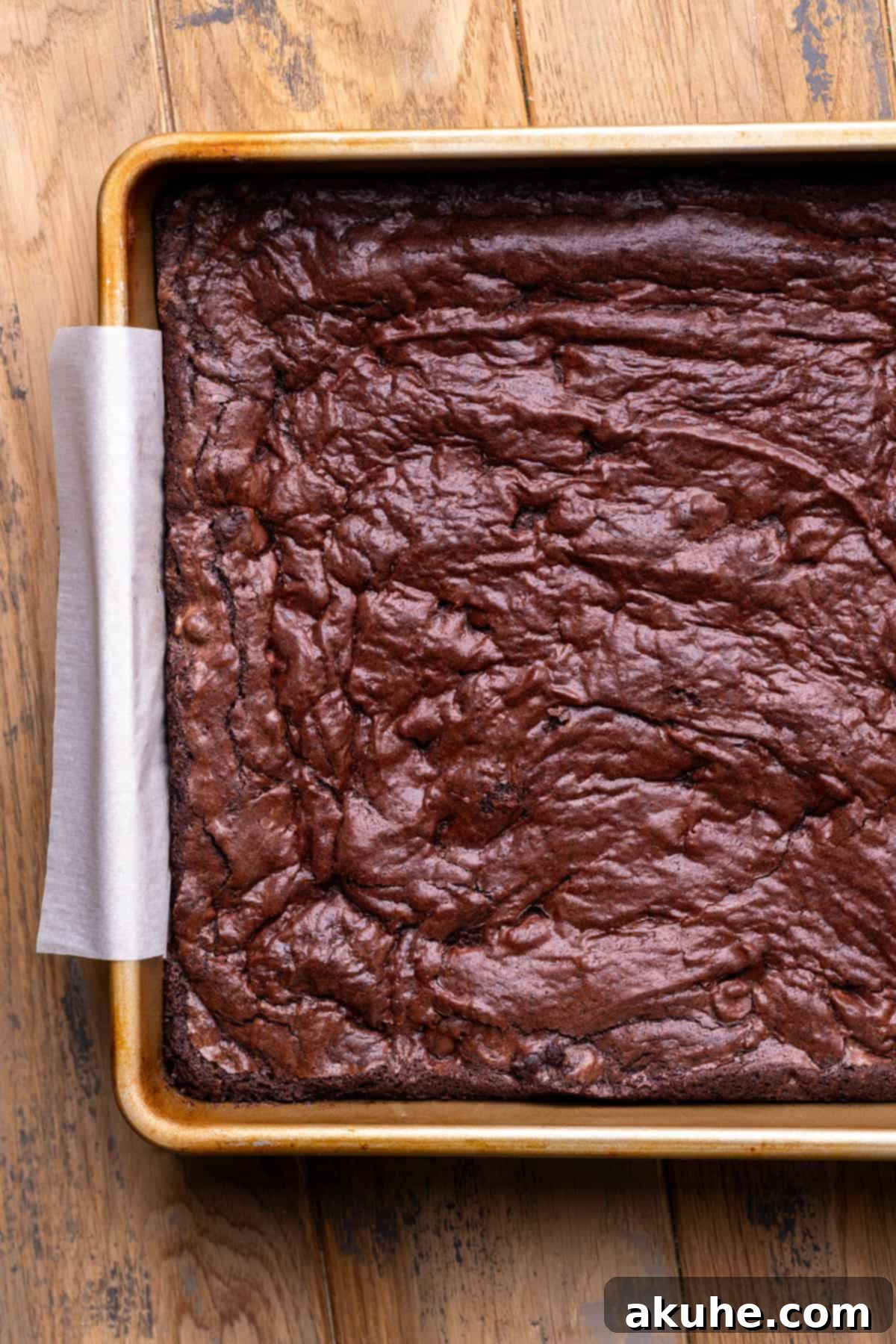 Decadent Cookie Dough Brownies 7 Freshly baked brownies cooling in the pan, displaying a beautiful crinkly top.