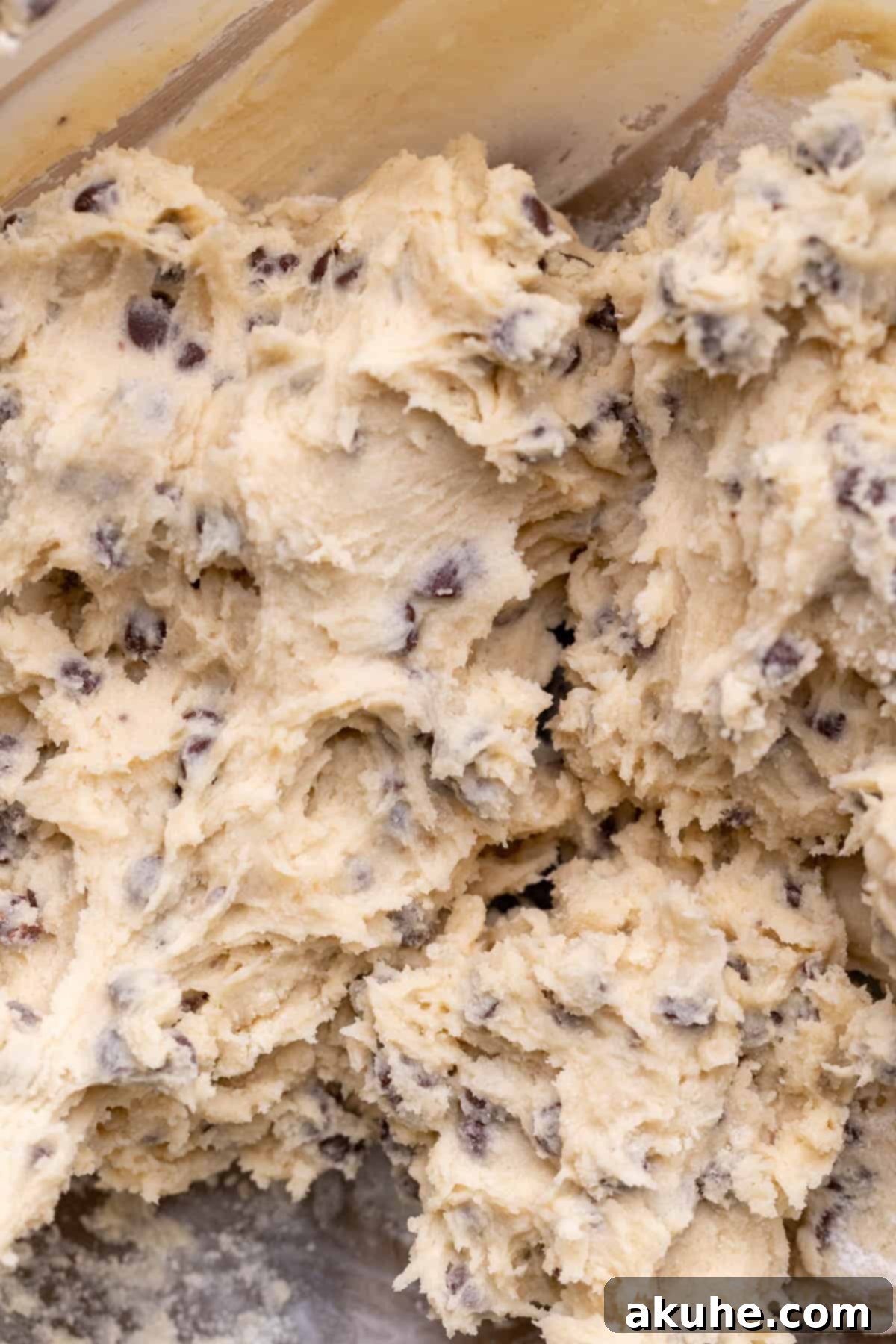 Decadent Cookie Dough Brownies 9 Finished edible cookie dough in a glass bowl, studded with mini chocolate chips.