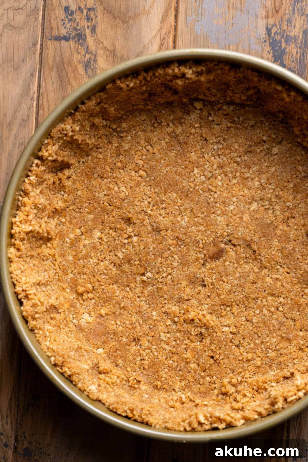 Zesty Lemon Blueberry Cheesecake 4 Crispy graham cracker crust perfectly formed in a springform pan, ready for the cheesecake filling.