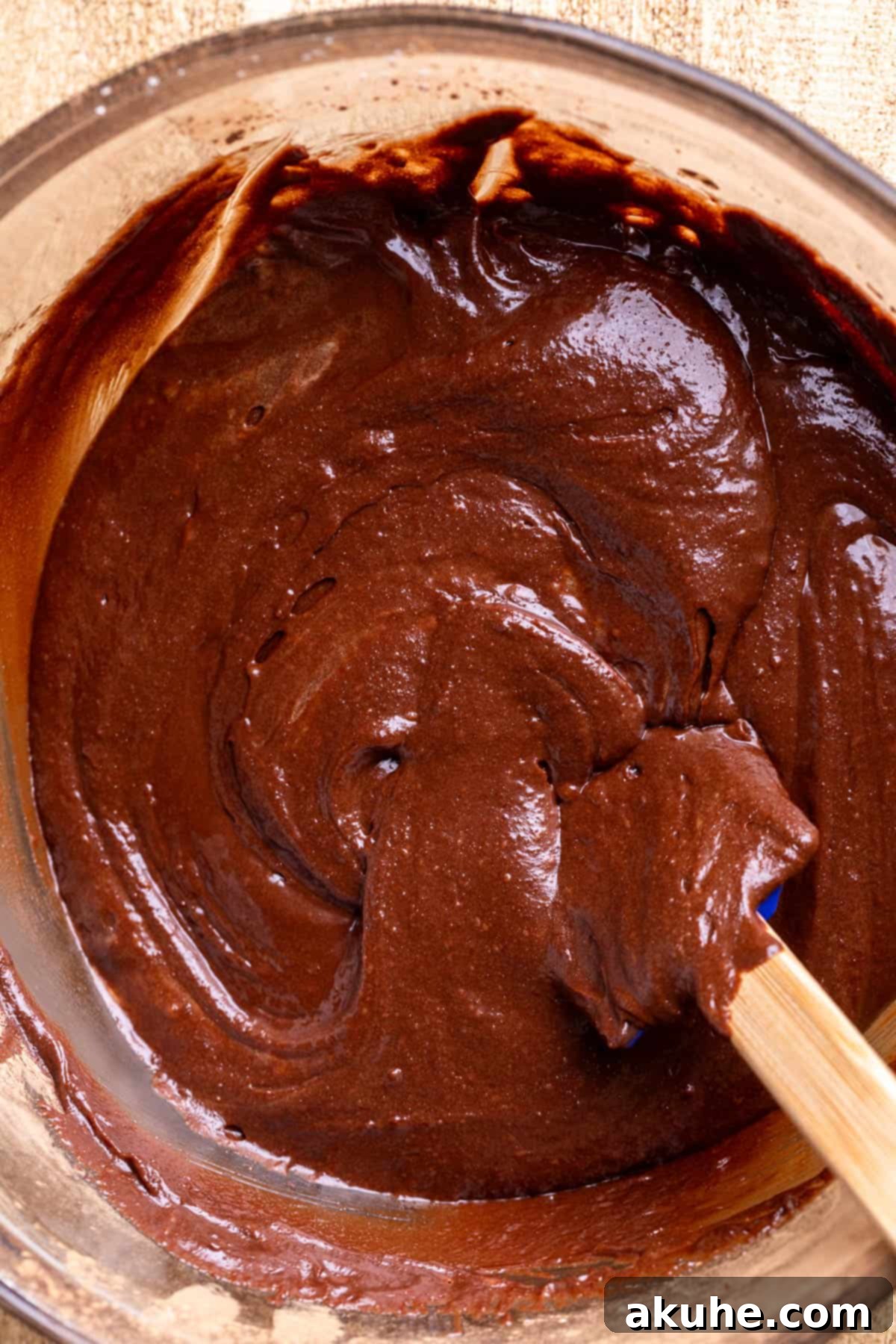 Decadent Cheesecake Brownies 6 Rich brownie batter in a glass bowl, ready for assembly.