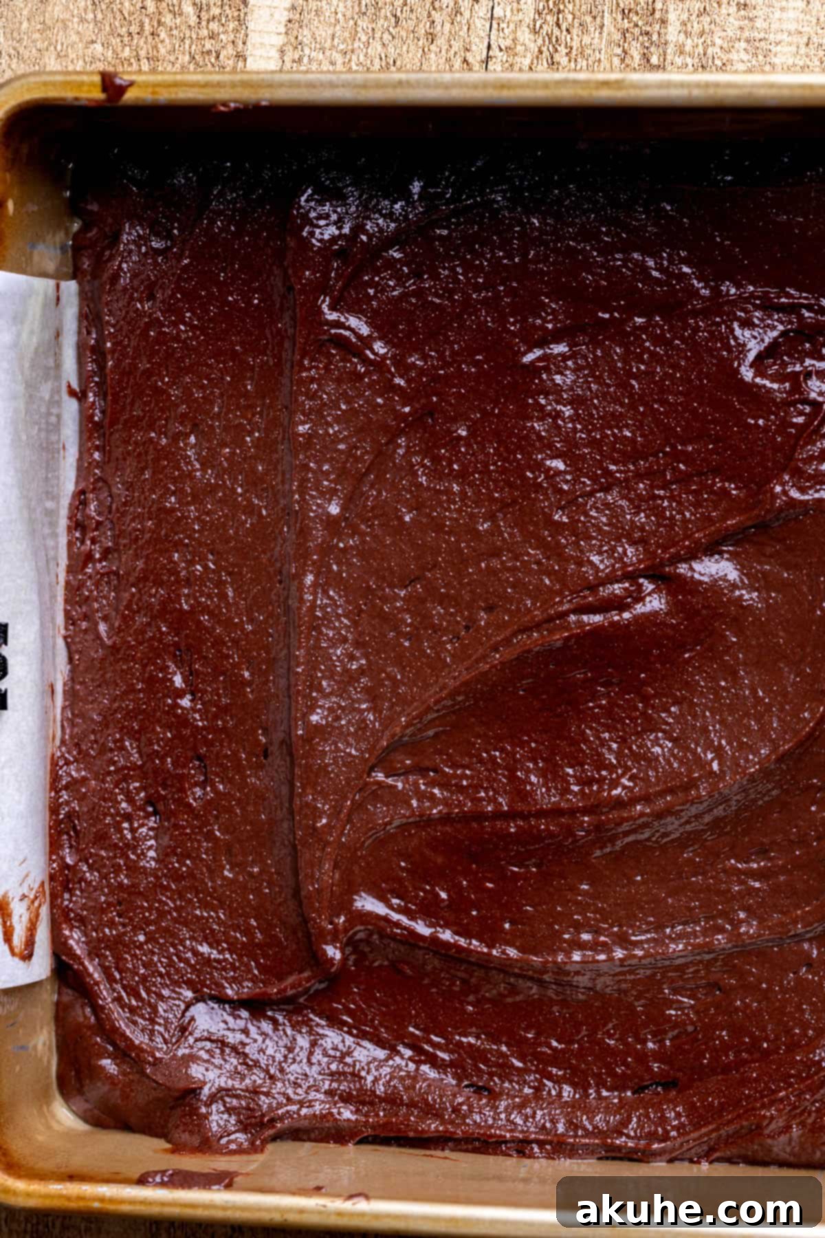 Decadent Cheesecake Brownies 7 First layer of rich brownie batter spread evenly in the baking pan.