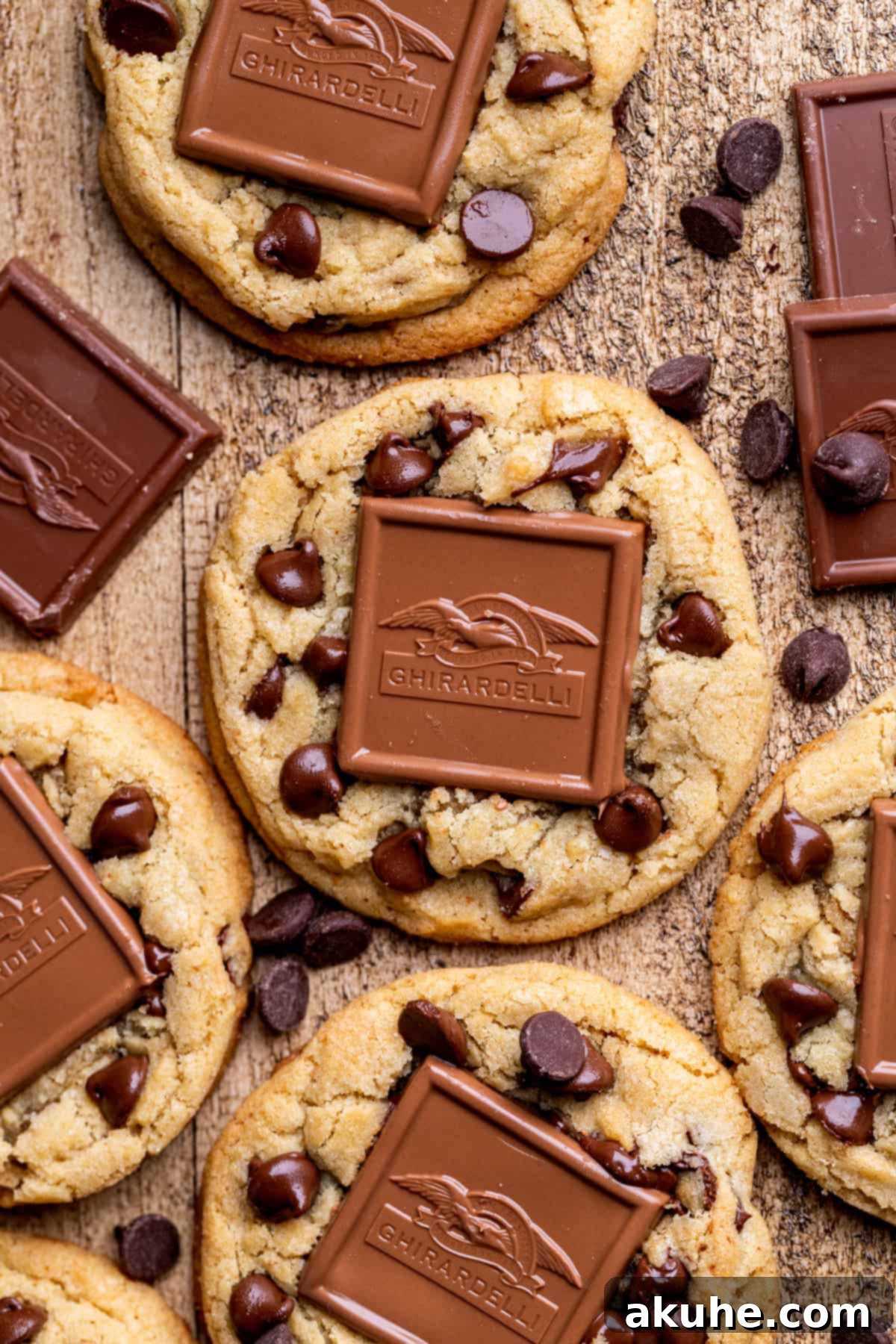 An overhead view of freshly baked brown butter chocolate caramel cookies arranged on a cooling rack.