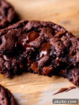 Fudgy Chocolate Delights 11 Stack of one chocolate fudge cookie split in half.