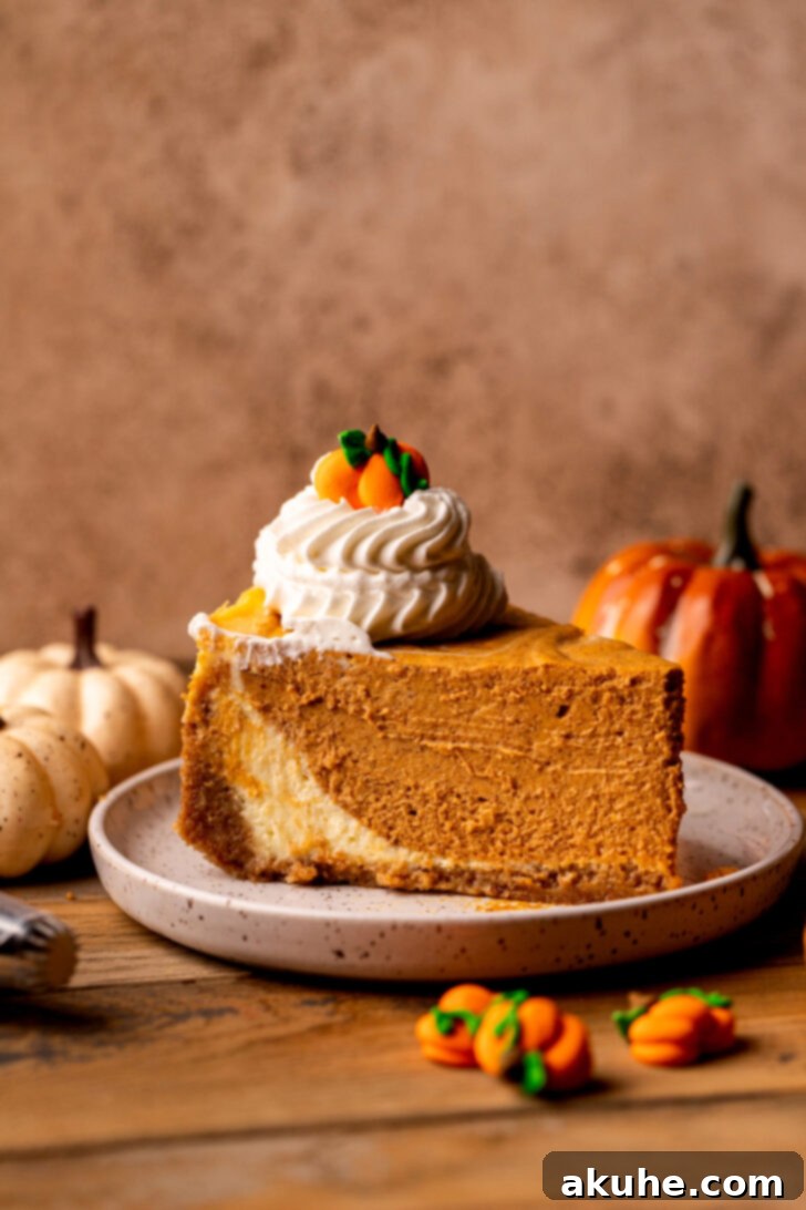 One slice of pumpkin cheesecake on a plate, showcasing its distinct layers.