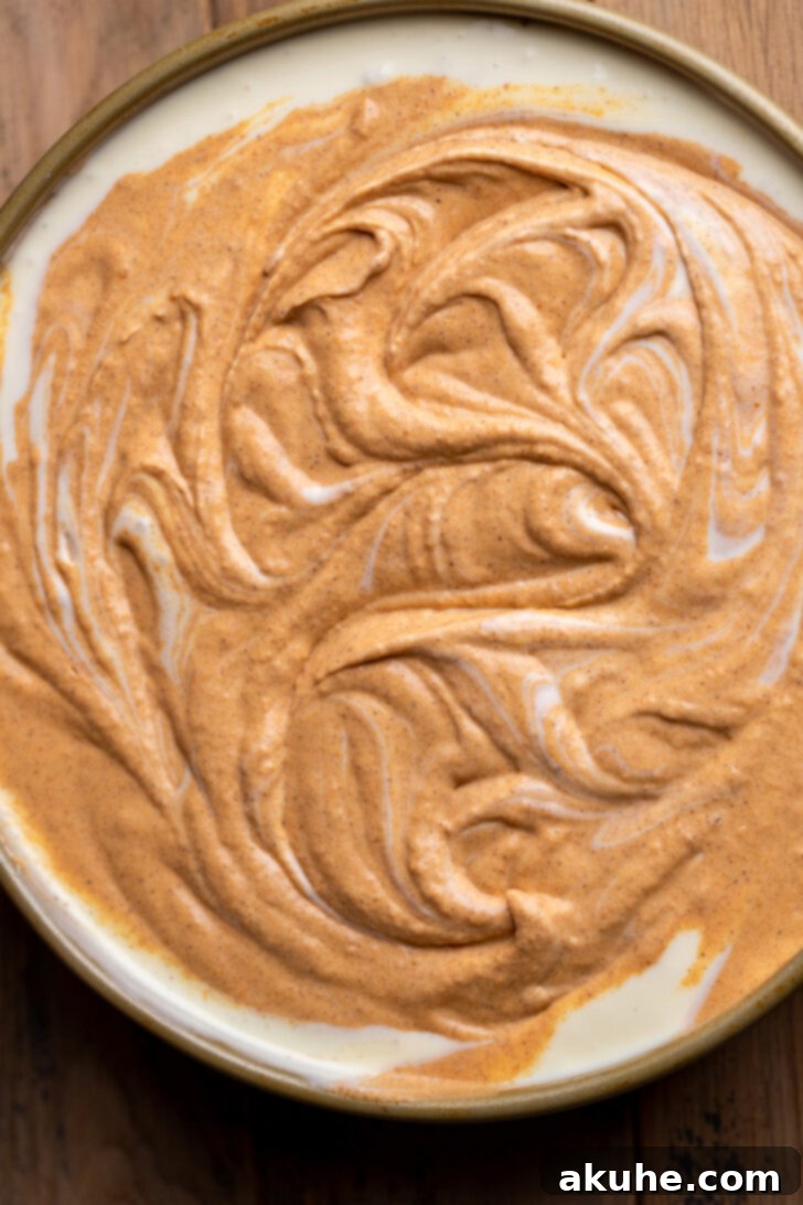 Pumpkin batter beautifully swirled into the regular cheesecake layer.