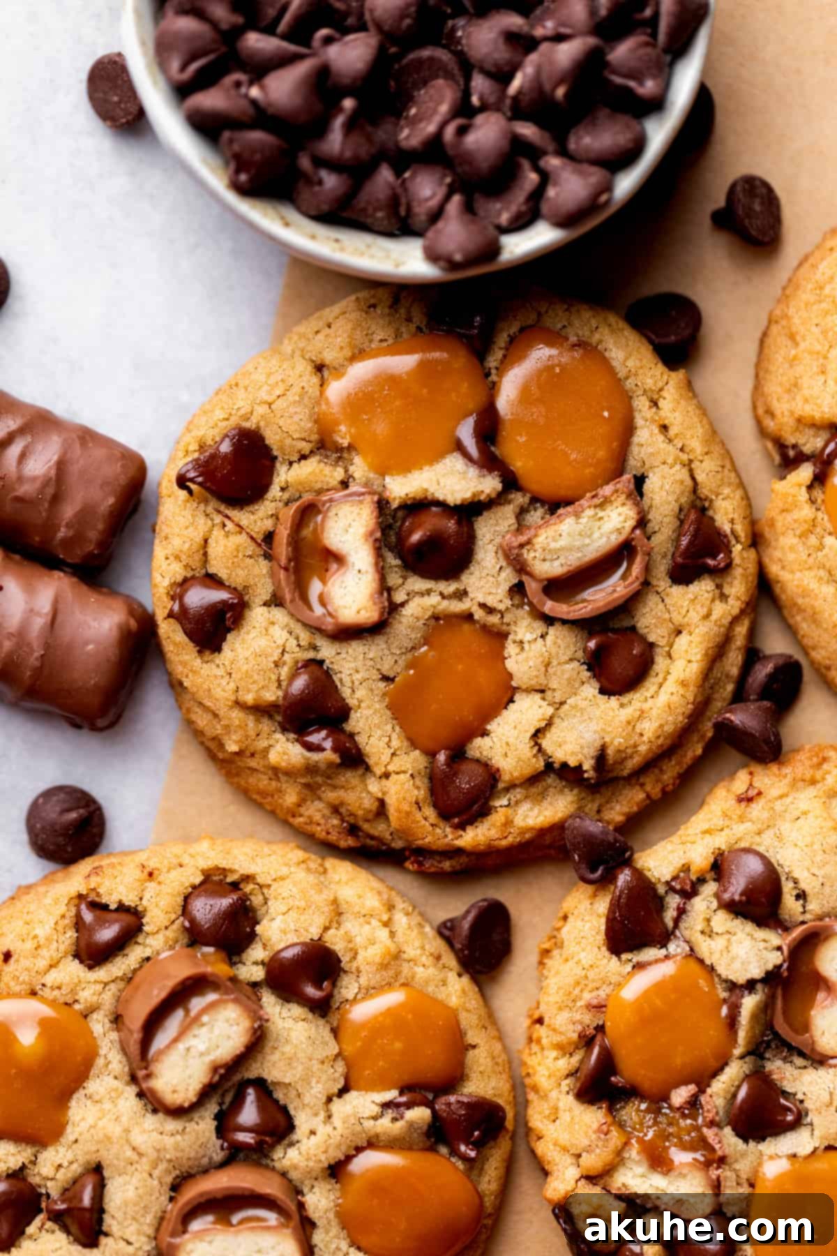 Top view of a freshly baked Twix cookie with melted caramel and chocolate, ready to be enjoyed.