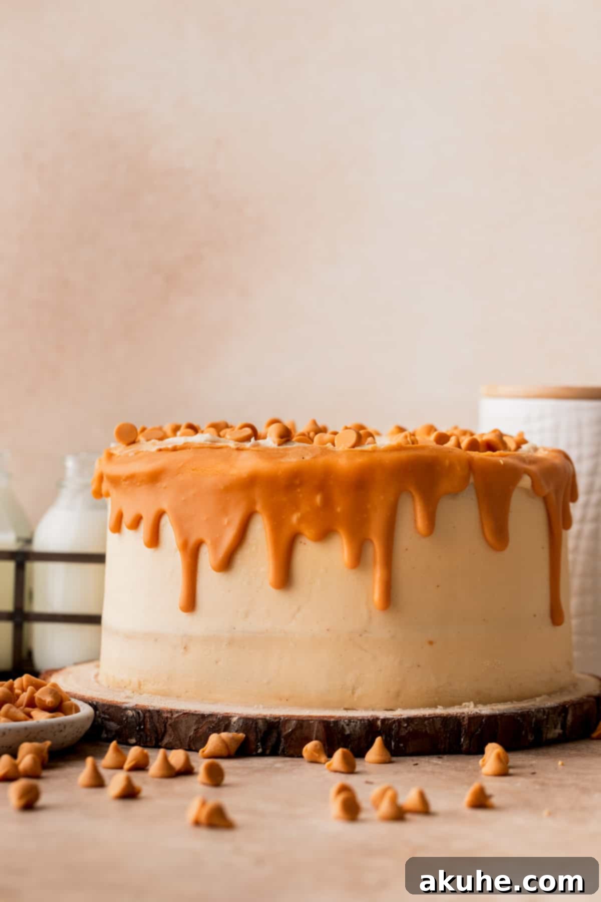 Rich Butterscotch Bliss 12 Decorated butterscotch cake on a wooden cake stand.