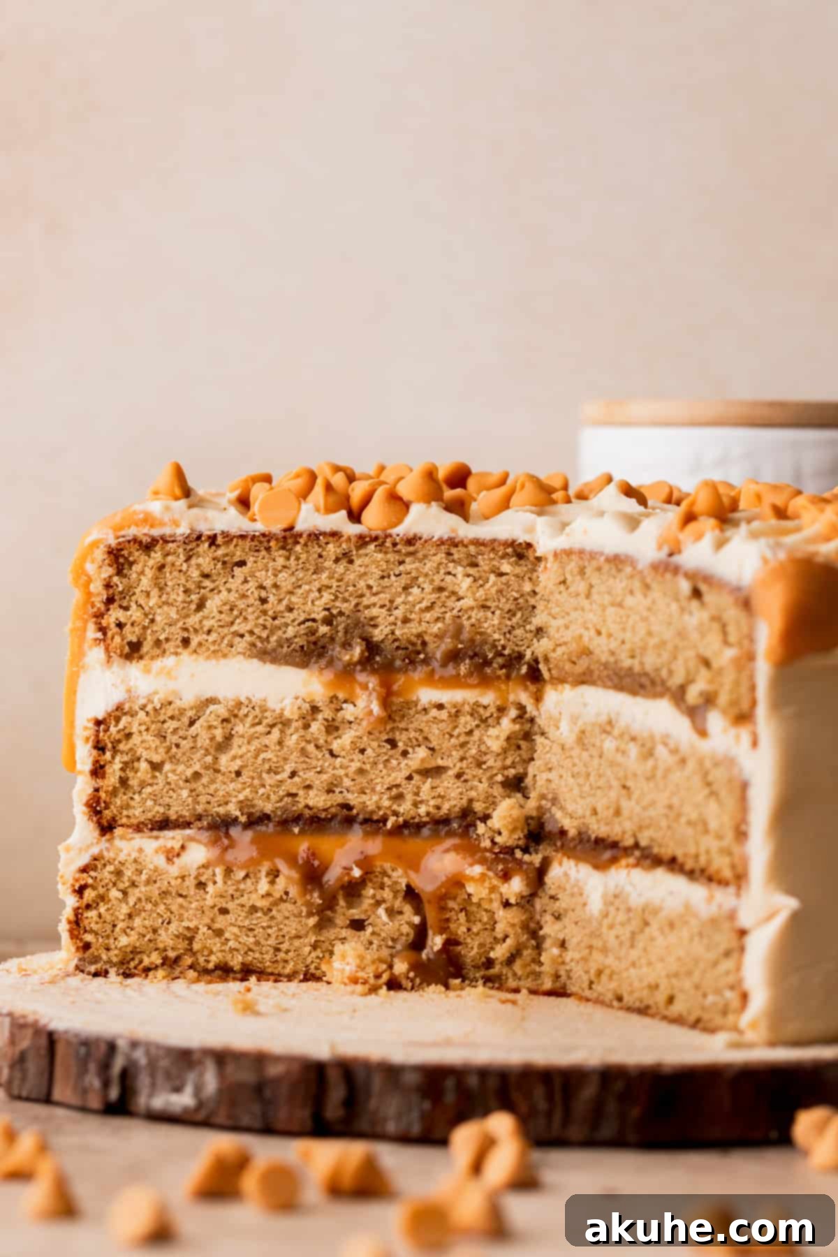 Rich Butterscotch Bliss 13 Close up of a slice of butterscotch cake on a wood board.