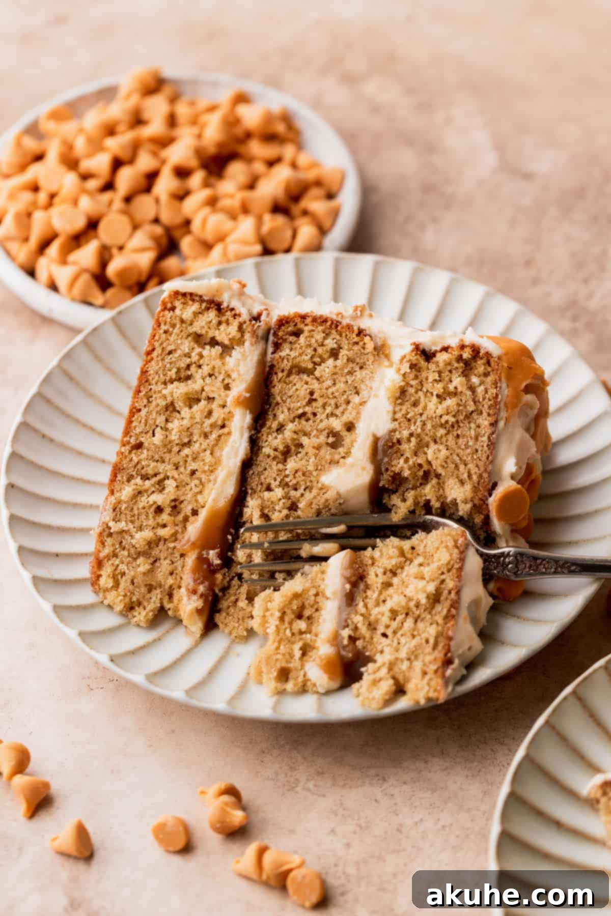 Rich Butterscotch Bliss 3 Slice of butterscotch cake with a fork inserted.