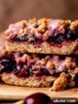 Classic Cherry Pie Bars 11 Stack of two cherry pie bars.