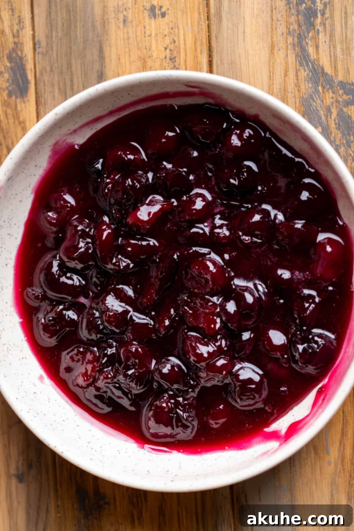 Classic Cherry Pie Bars 4 A bowl filled with vibrant red homemade cherry pie filling.