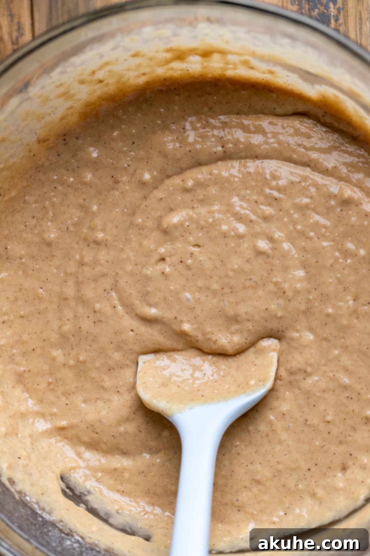 Muffin batter in a glass bowl.