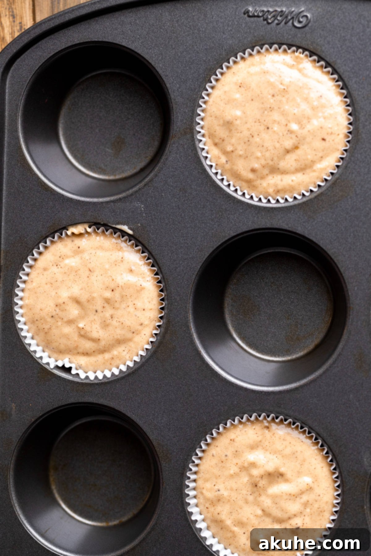 Muffin batter in a pan.