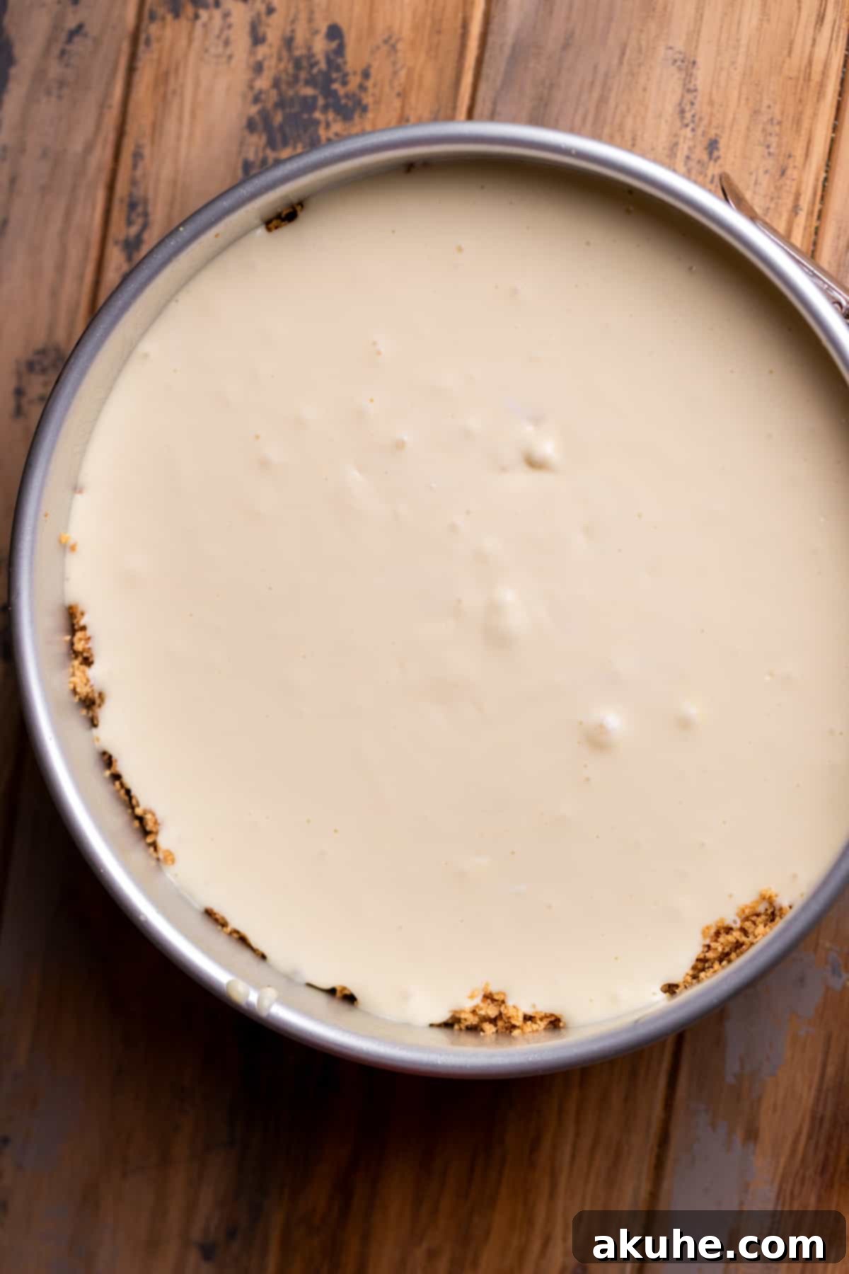 Spiced Apple Cider Cheesecake 7 Apple cider cheesecake in a pan.