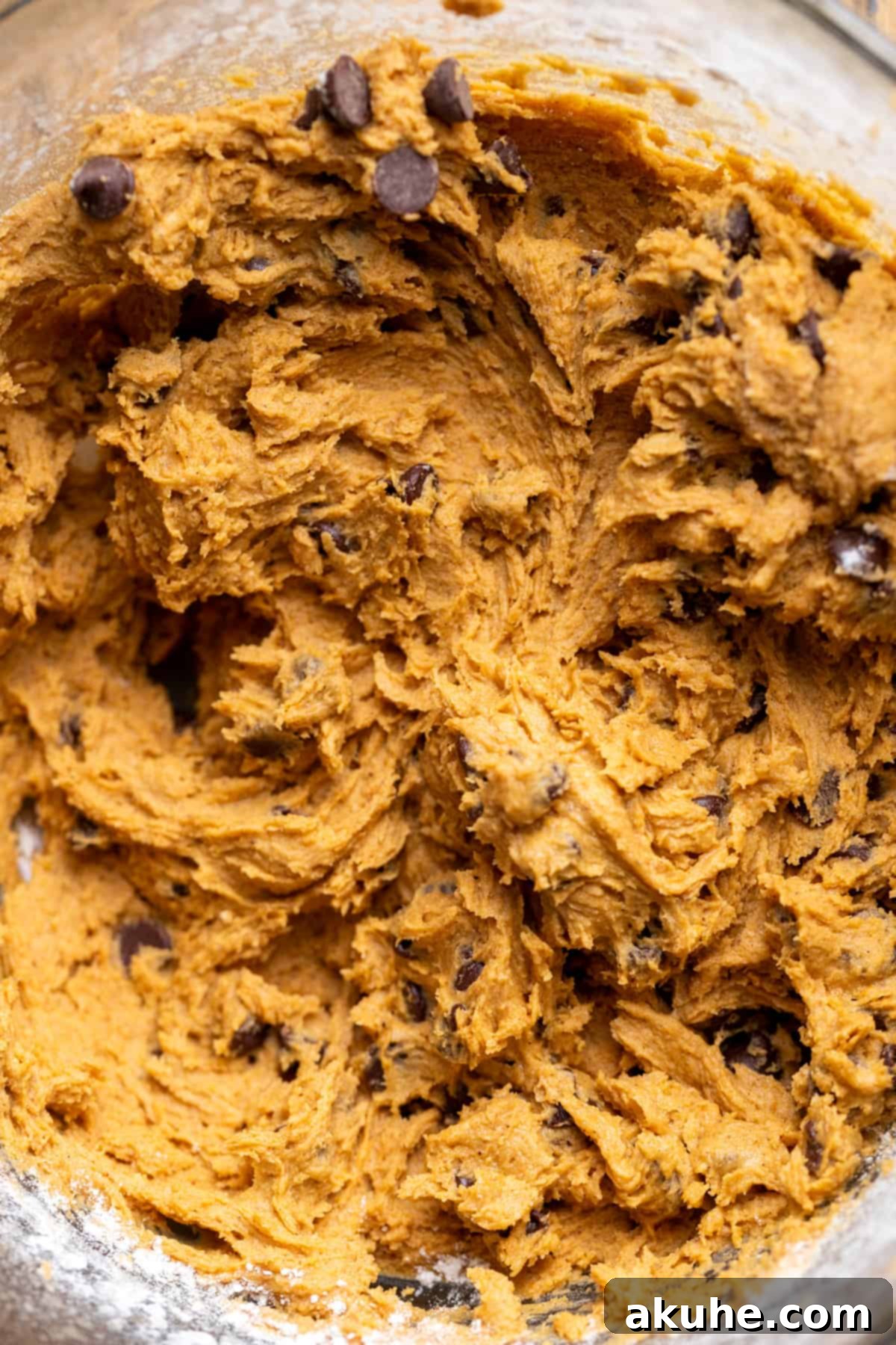 Spiced Pumpkin Chocolate Chip Cookies 5 Cookie dough in a glass bowl after all ingredients have been mixed, ready for scooping and baking.